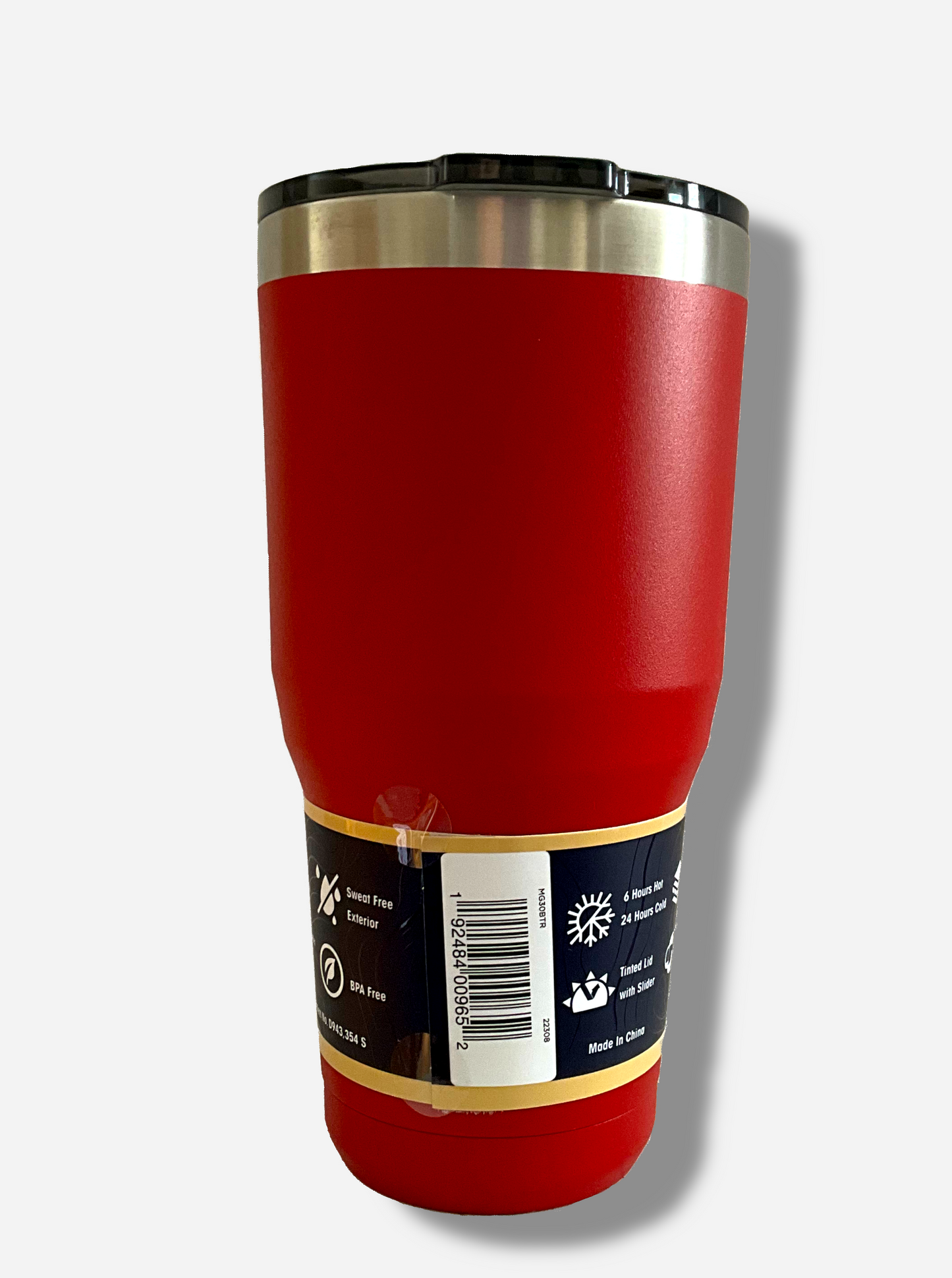 A picture of the back of a tall, red tumbler. The surface is smooth and red, as it is red paint covering stainless steel. The top is black plastic. The top of the mug is lined with a stainless steel band. A paper wrapper around the bottom has a diagram that reads 30 oz, next to the barcode.