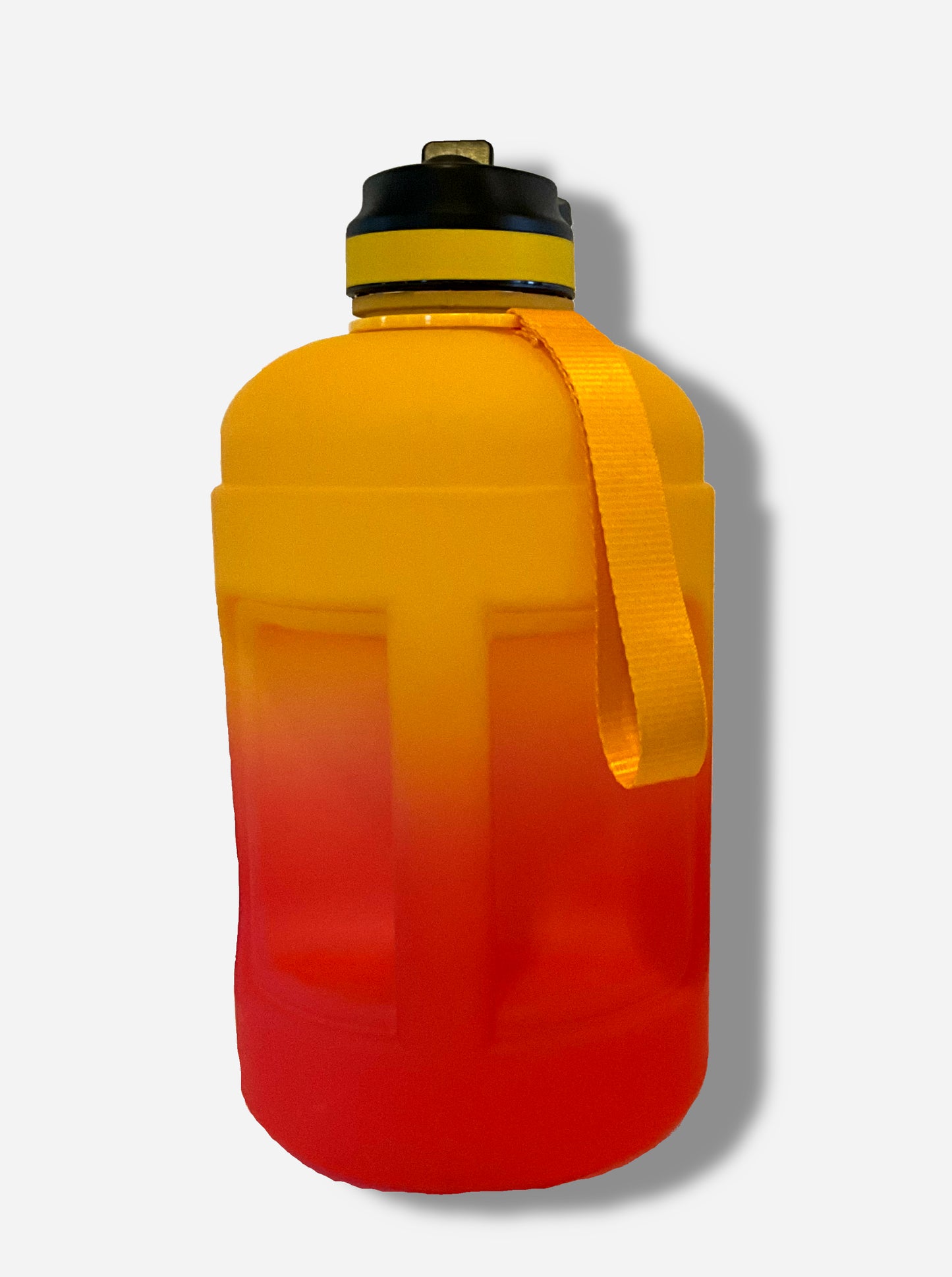 A picture of the back of a large, cylindrical hydration jug, made of plastic. The bottom is a vibrant red, shading upward through a gradient to a brilliant gold at the top. A long yellow carry strap is on the side, and on the top, a black plastic handle. The top of the jug is black plastic, with a yellow band, and a flip-top straw-in-lid in black and yellow. The back shows a large handle on the side of the jug, in the same gradient colors as the rest of the jug