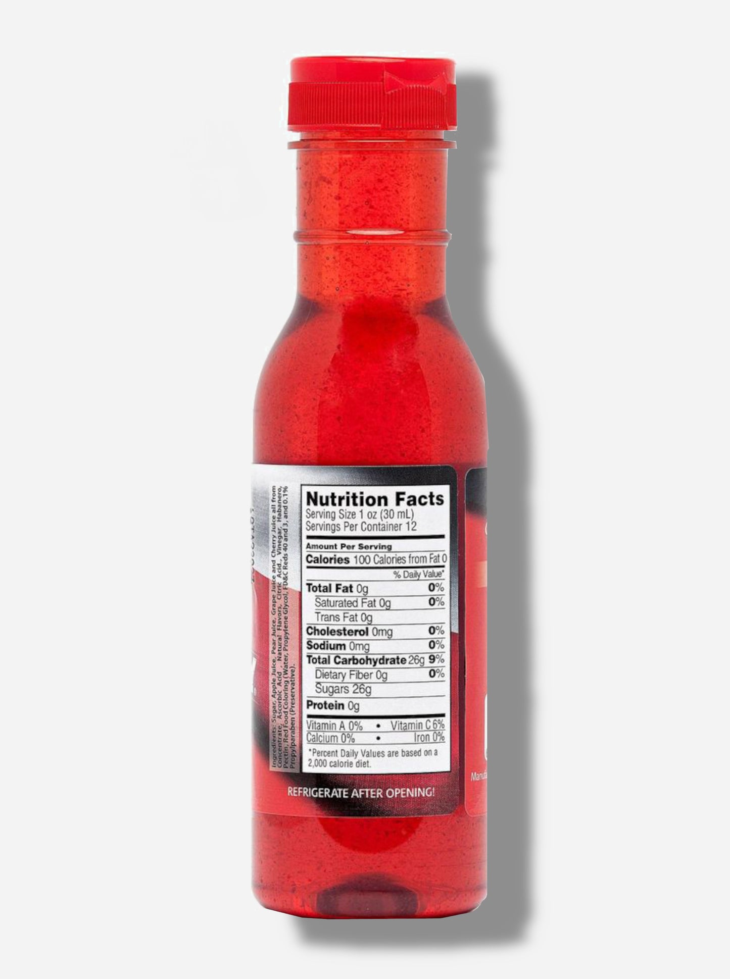 A picture of a the back of a plastic bottle of Texas Pepper Jelly's "The Original Rib Candy", Apple Cherry Habanero flavor. The bottle is cylindrical and clear & the top is covered by a plastic red flip top.Inside the bottle is a bright red thick fluid, with air bubbles suspended in the fluid. The bottom of the label under the nutrition facts reads REFRIGERATE AFTER OPENING.