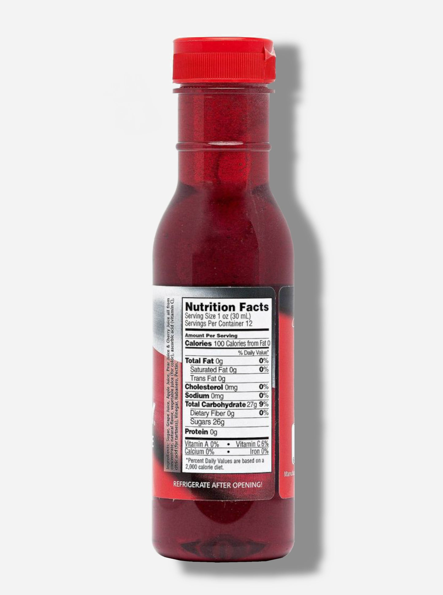 A picture of a the back of a plastic bottle of Texas Pepper Jelly's "The Original Rib Candy", Black Cherry Grape Habanero flavor. The bottle is cylindrical and clear & the top is covered by a plastic red flip top.Inside the bottle is a dark red thick fluid, with air bubbles suspended in the fluid. The bottom of the label under the nutrition facts reads REFRIGERATE AFTER OPENING.