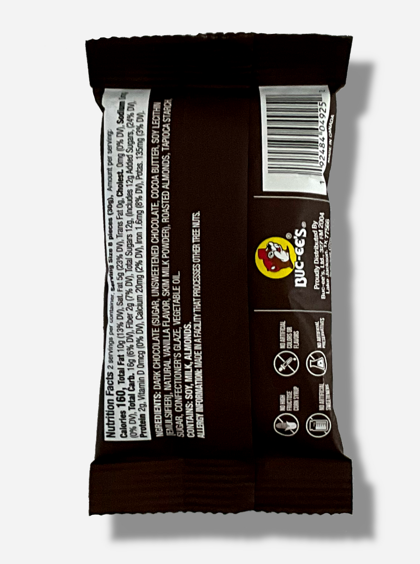 A picture of the back of a small package of Buc-ee's Dark Chocolate Almonds, 2 oz. The bag is dark brown.