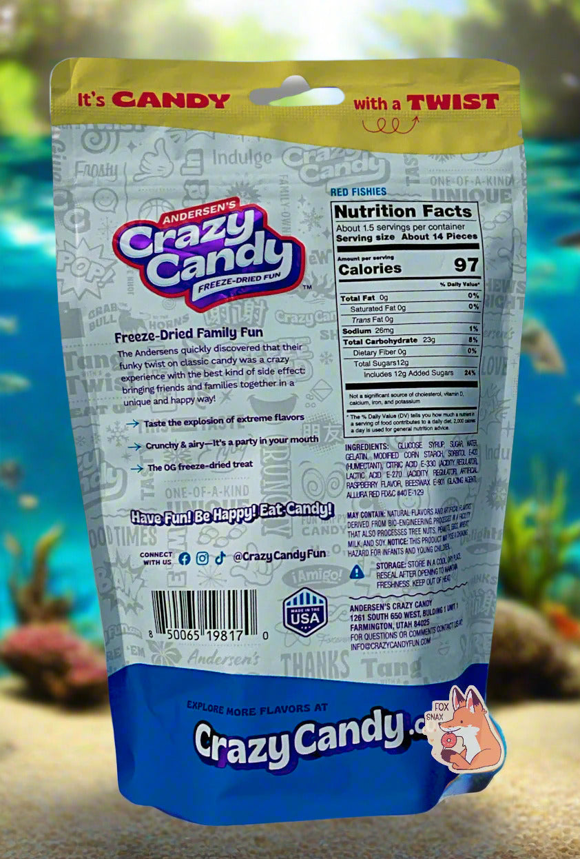 The back of a large bag of Andersen's Crazy Candy Red Fishies. The bag reads: Freeze Dried Family Fun. The Andersens quickly discovered that their funky twist on classic candy was a crazy experience with the best kind of side effect: bringing friends and families together in a unique and happy way! The background is an underwater tropical ocean view, covered in beautiful tropical fish.