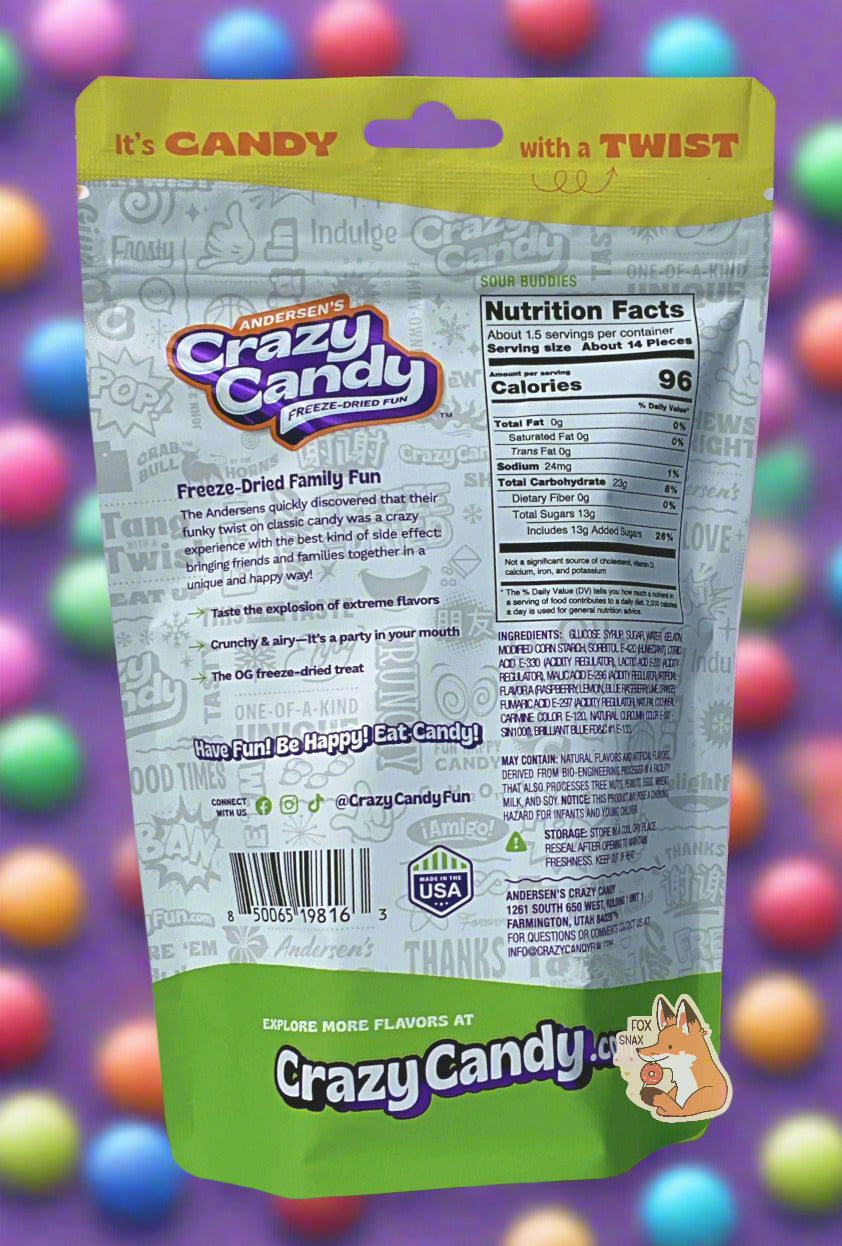 The back of a large bag of Andersen's Crazy Candy Sour Buddies. The bag reads: Freeze Dried Family Fun. The Andersens quickly discovered that their funky twist on classic candy was a crazy experience with the best kind of side effect: bringing friends and families together in a unique and happy way! The background shows a purple background with a variety of brightly colored candy dots.