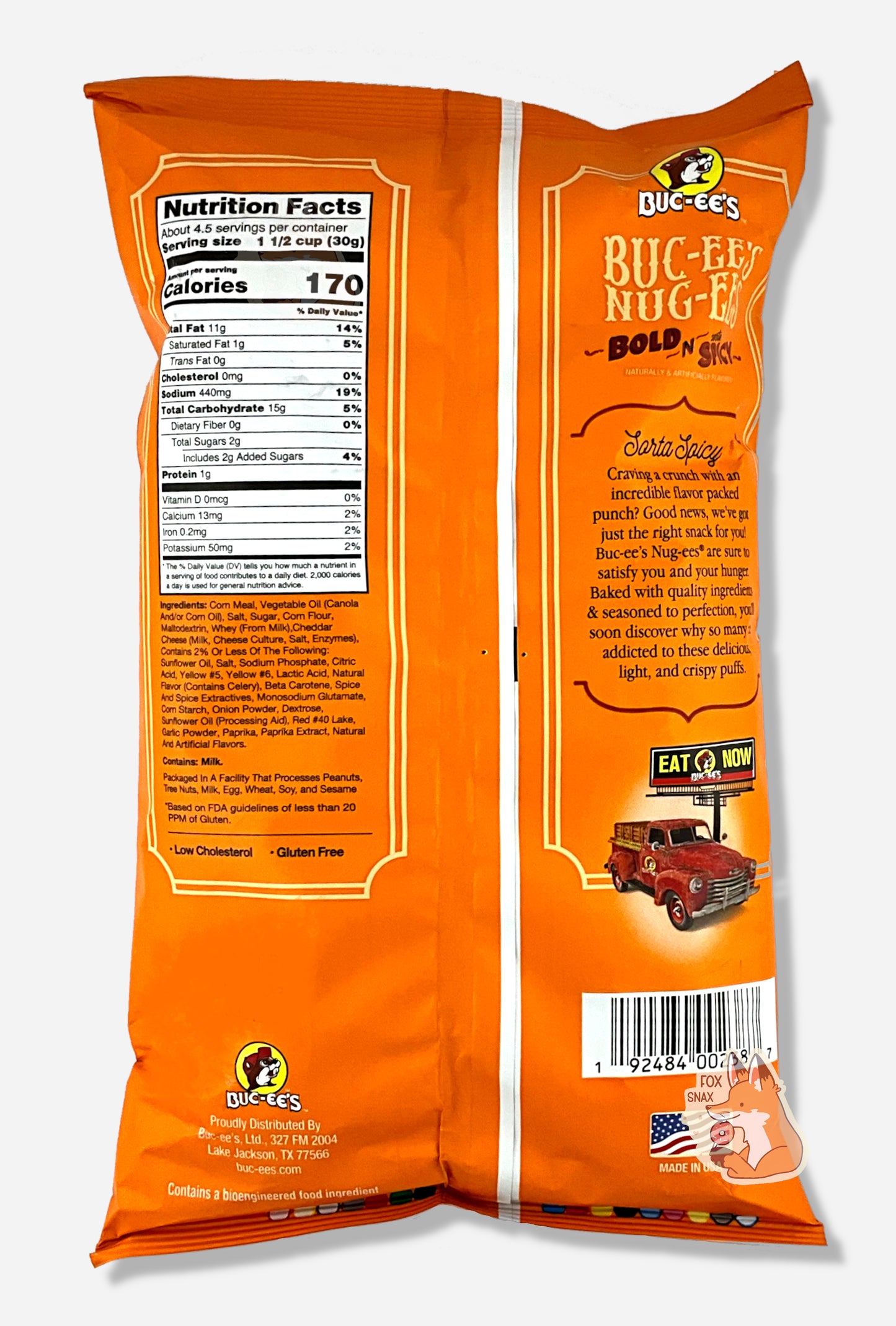 A picture of the back of a opaque, orange and yellow bag of Buc-ee's Bold N Sorta Spicy Nug-ee's. The bag reads: Sorta Spicy, Craving a crunch with incredible flavor packed punch? Good news, we've got just the right snack for you! Buc-ee's Nug-ees(r) are sure to satisfy you and your hunger. Baked with quality ingredients & seasoned to perfection, you'll soon discover why so many are addicted to these delicious, light, and crispy puffs.