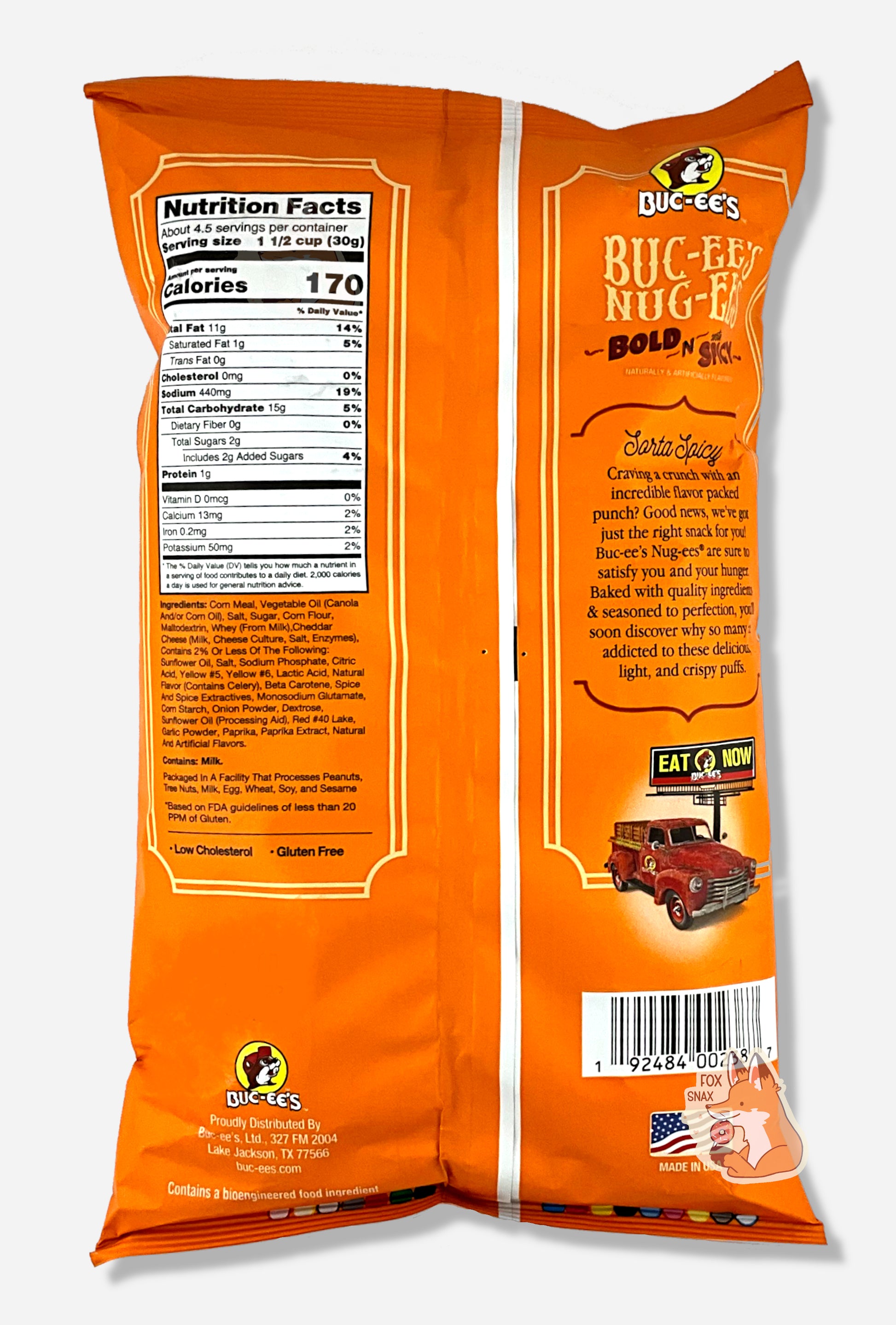 A picture of the back of a opaque, orange and yellow bag of Buc-ee's Bold N Sorta Spicy Nug-ee's. The bag reads: Sorta Spicy, Craving a crunch with incredible flavor packed punch? Good news, we've got just the right snack for you! Buc-ee's Nug-ees(r) are sure to satisfy you and your hunger.  Baked with quality ingredients & seasoned to perfection, you'll soon discover why so many are addicted to these delicious, light, and crispy puffs.