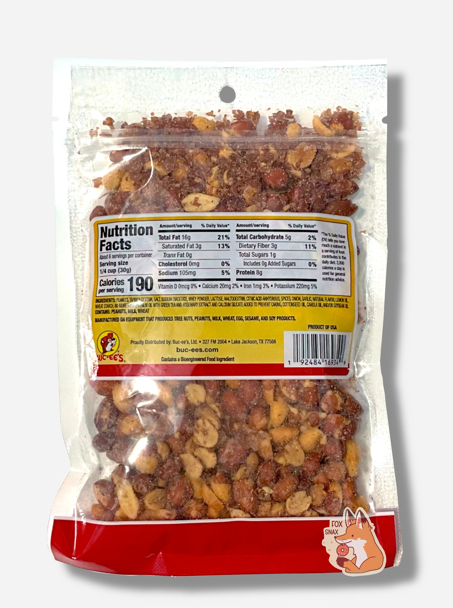 A picture of the back of a resealable bag of Buc-ee's Dill Pickle Southern Fried Peanuts, which are deep fried, shelled peanuts. The peanuts inside are differing shades of brown and tan, and show a few grains of salt and dill flavoring on them or in the bag. Nutrition facts, then ingredients are shown.