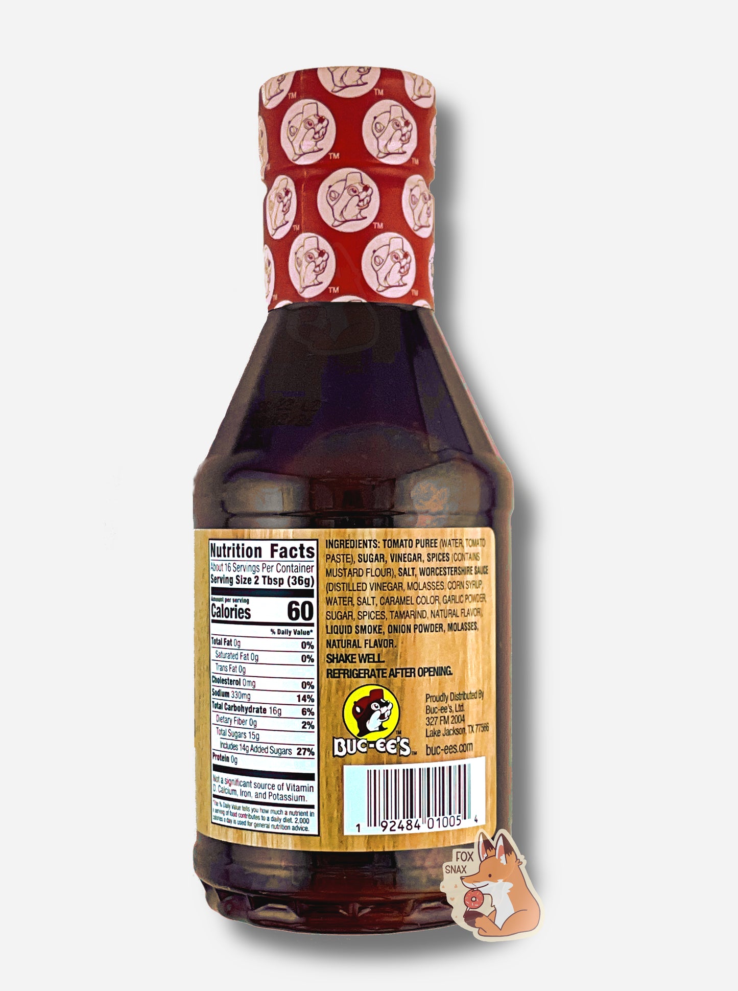 The back of a plastic bottle of Buc-ee's Premium Recipe BBQ Sauce, Original. The top of the bottle is sealed with a plastic wrap in red and white, dotted with Buc-ee's logos. The BBQ label is a woodgrain, with a small Buc-ee logo on the bottom. The label reads: SHAKE WELL. REFRIGERATE AFTER OPENING.