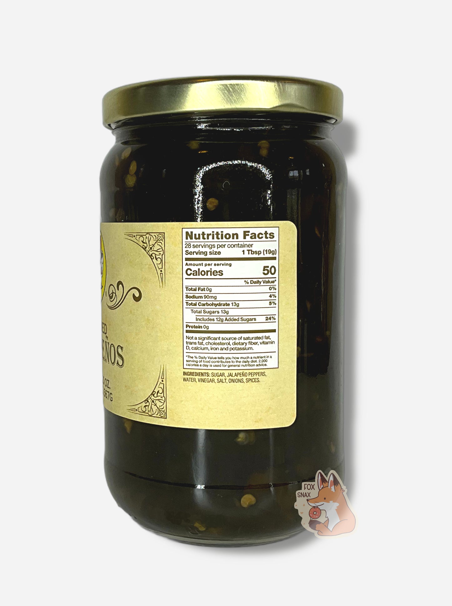 A picture of the right side of a glass jar of Buc-ee's Candied Jalapeños - the label is a "old-timey" sort of white/yellow with flared edges. The middle reads Ingredients: Sugar, Jalapeno Peppers, Water, Vinegar, Salt, Onions, Spices. In the jar, dark green jalapeños can be seen.