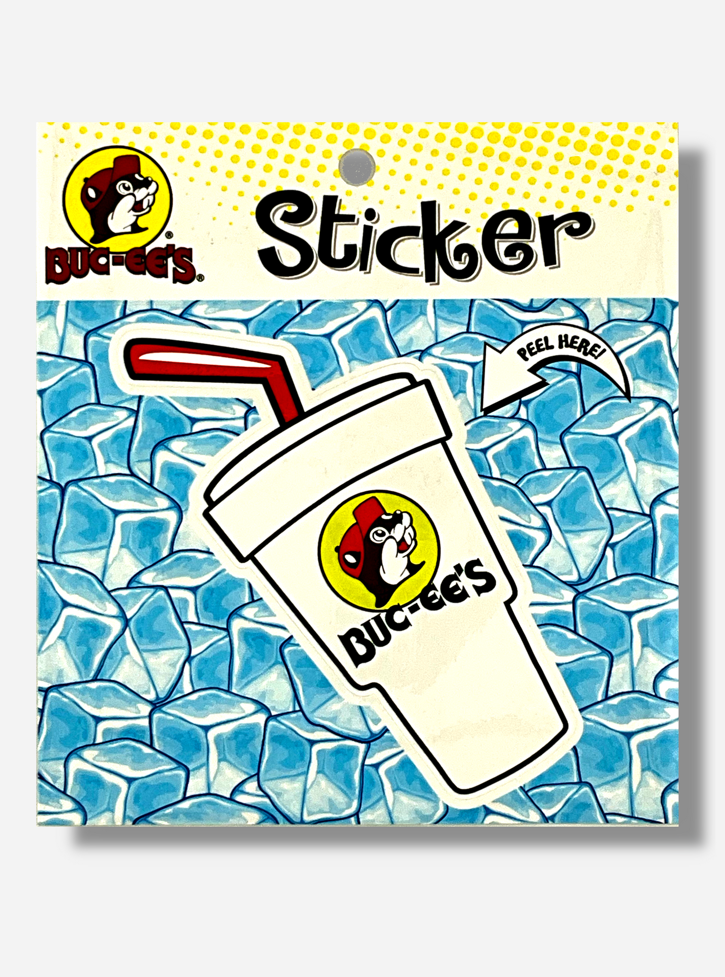 A picture of a Buc-ee's vinyl sticker. The sticker is of a large white Styrofoam drink cup. A red straw pokes out of the top of it, in a cartoonish fashion. The cup has a large Buc-ee's logo on it, which is a cheerful beaver with a red ball cap, and underneath the logo, text in black reading BUC-EE'S. On the sticker's packaging are the words PEEL HERE!, which point to the styrofoam cup sticker. The background of the sticker reads STICKER, and shows blue ice cubes.