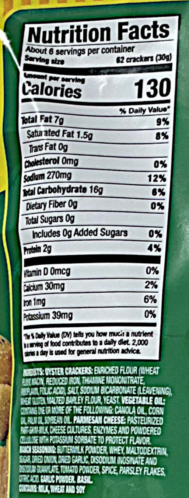 A closeup of the back of a bag of Buc-ee's Garlic Parmesan Crackers. Nutrition facts, then ingredients are listed.