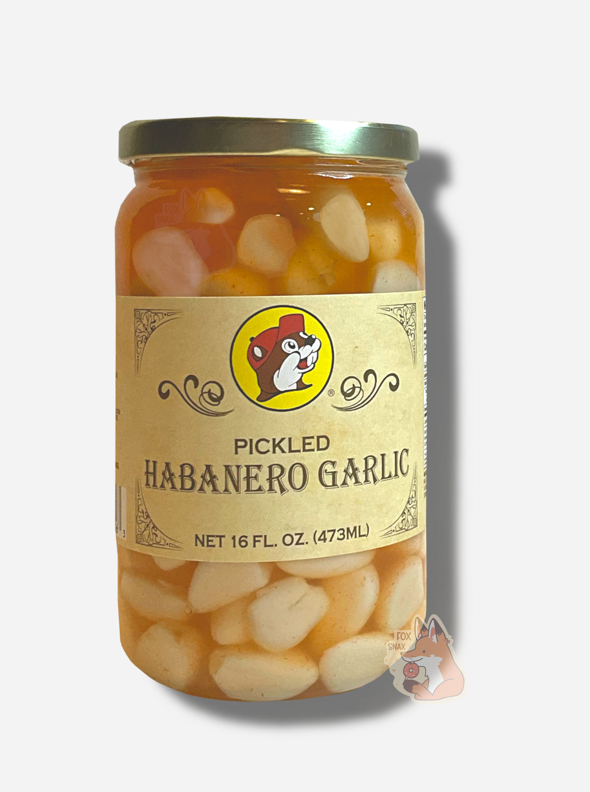 A picture of the front of a glass jar of Buc-ee's Pickled Habanero Garlic - the label is a "old-timey" sort of white/yellow with flared edges. The middle has a giant Buc-ee the Beaver logo on it. In the jar, floating garlic cloves in an orange habanero brine can be seen.