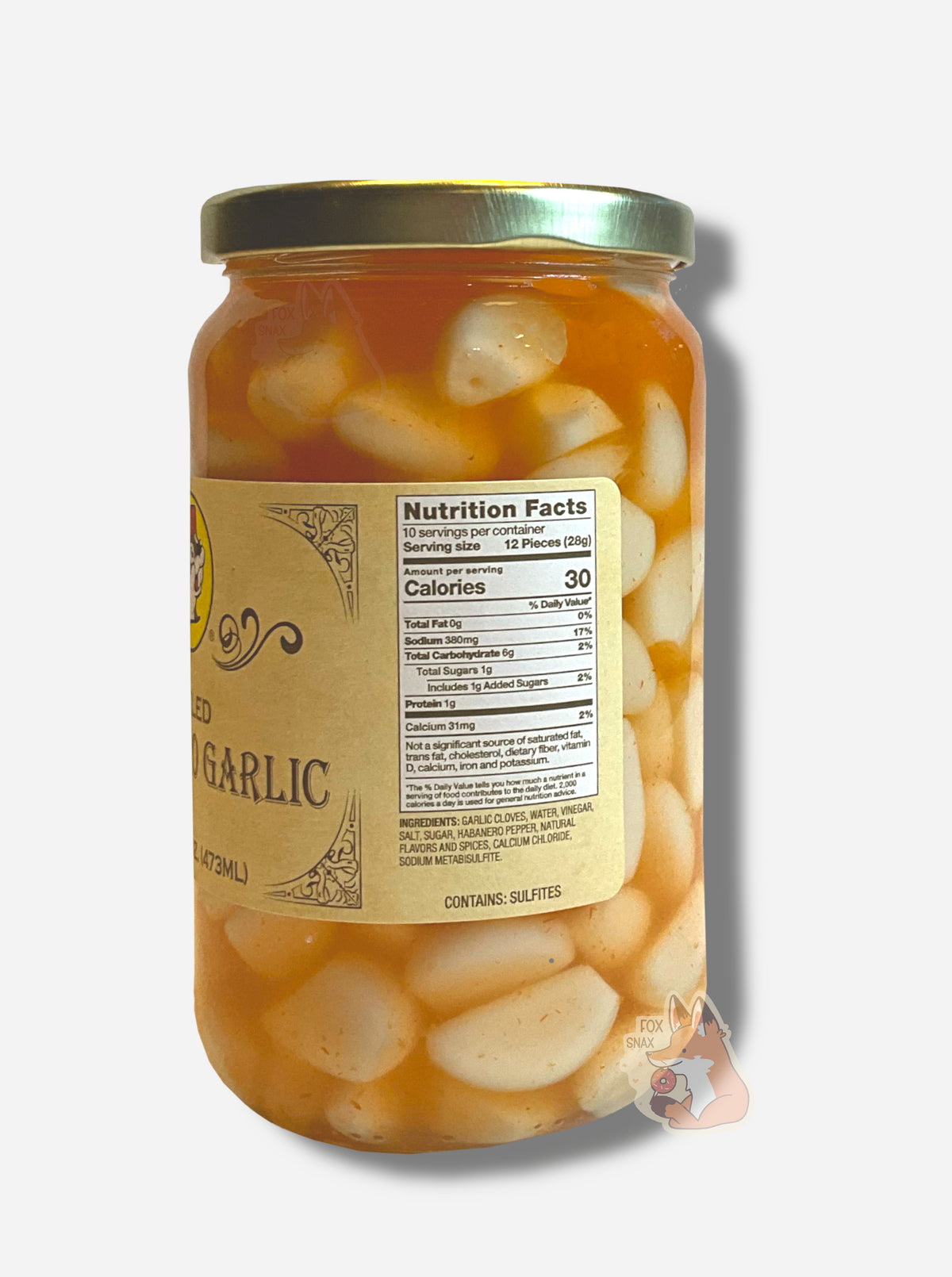 A picture of the right side of a glass jar of Buc-ee's Pickled Habanero Garlic - the label is a "old-timey" sort of white/yellow with flared edges. The middle reads Ingredients: Garlic Gloves, Water, Vinegar, Salt, Sugar, Habanero Pepper, Natural Flavors and Spices, Calcium Chloride, Sodium Metabisulfite. In the jar, garlic cloves floating in orange habanero brine can be seen.