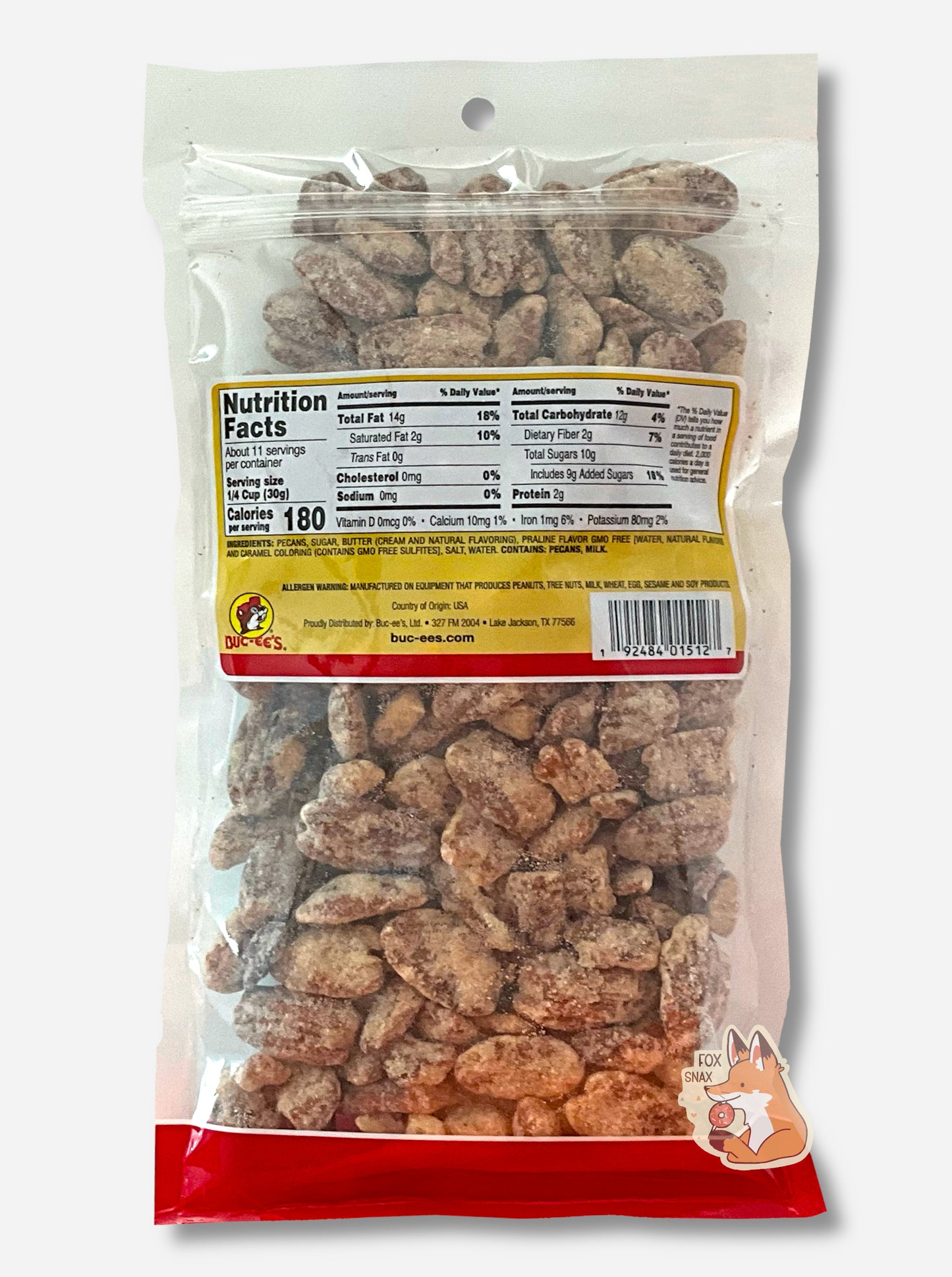 A picture of the back of a clear plastic bag of Buc-ee's Praline Pecans. Inside the bag are a large number of dried pecans, covered in brownish sugary praline material.