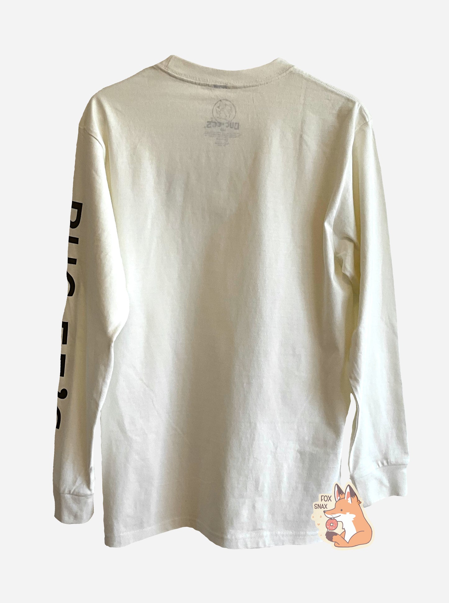 A picture of the back of a white, long sleeve shirt. Running down the left arm, in large black text, reads BUC-EE'S.