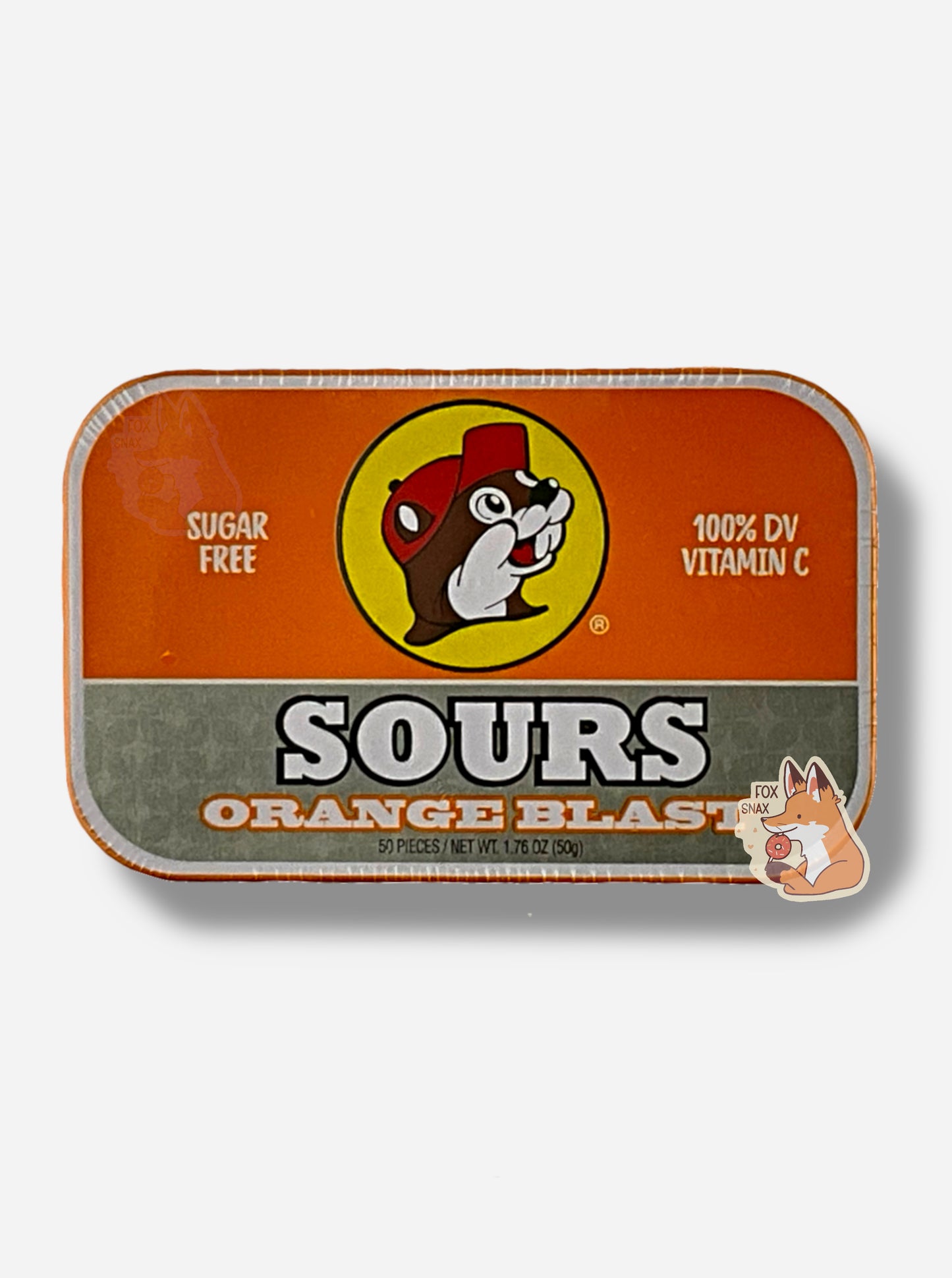 A picture of a tin of Buc-ees Orange Blast Sours. The cover is decorated with a big picture of Buc-ee The Beaver, and has an orange and silver background. The tin reads Sugar Free, 100% DV Vitamin C, Sours, Orange Blast, 50 pieces.
