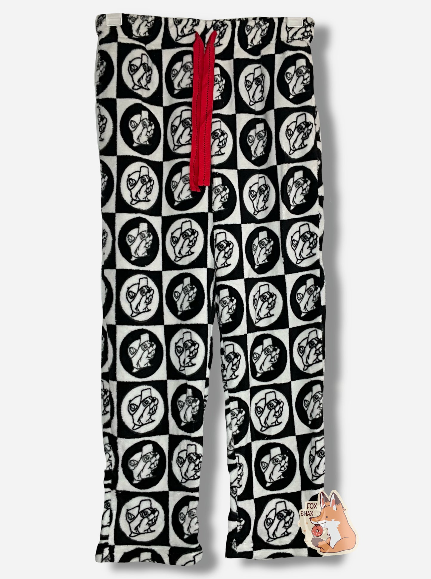 A picture of a pair of fuzzy lounge pants. The pants are black and white; the surface has tons of Buc-ee beaver heads on it, checkered alternately in white and black circles and squares. There is a red drawstring to cinch the pants around one's waist, and it is made of a red cloth.