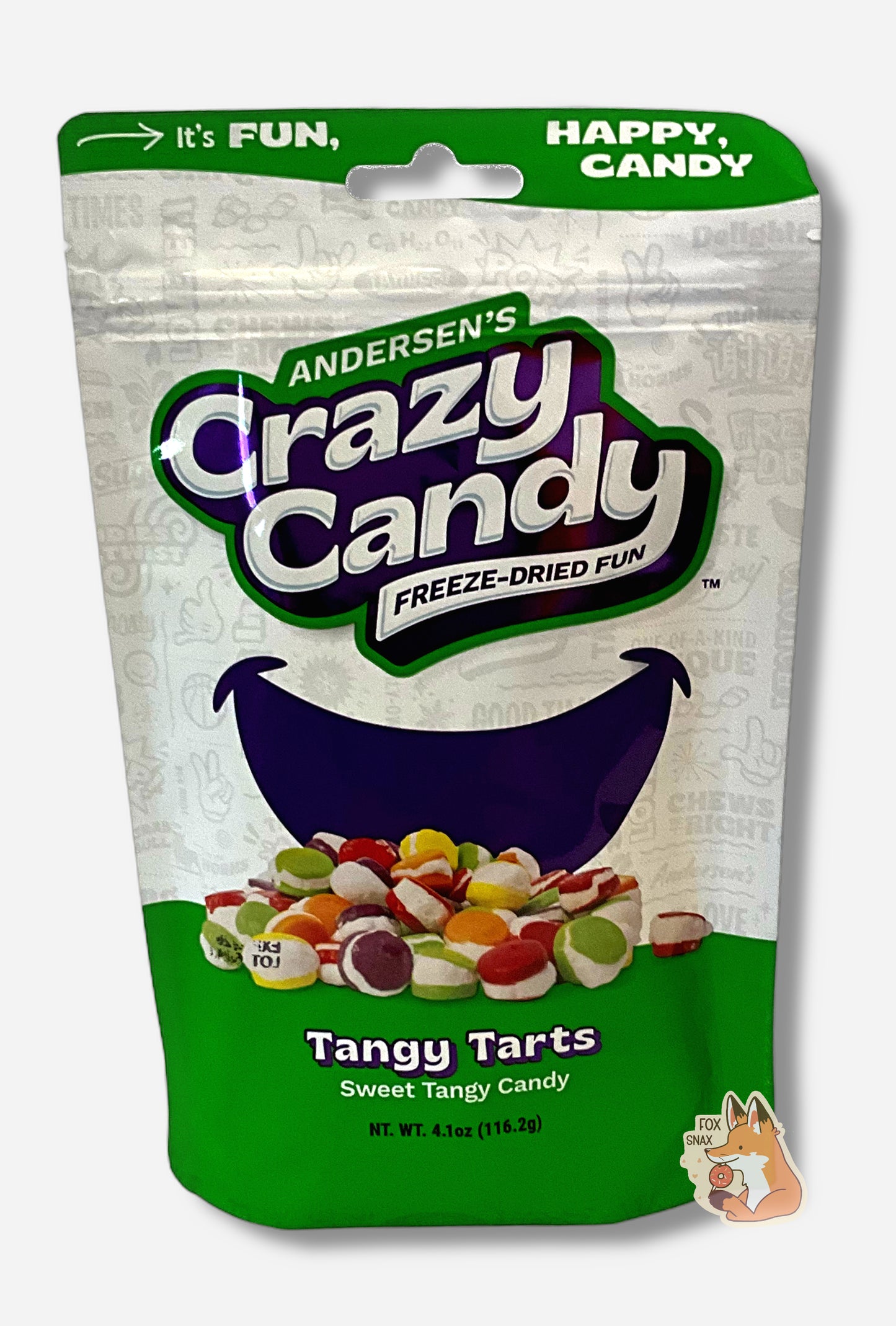 A large bag of Andersen's Tangy Tarts. The front of the bag also says Sweet Tangy Candy, Net Weight 4.1 oz. It's Fun, Happy, Candy. The top and bottom of the bag are pink, and the background is a large purple smile against a white background.