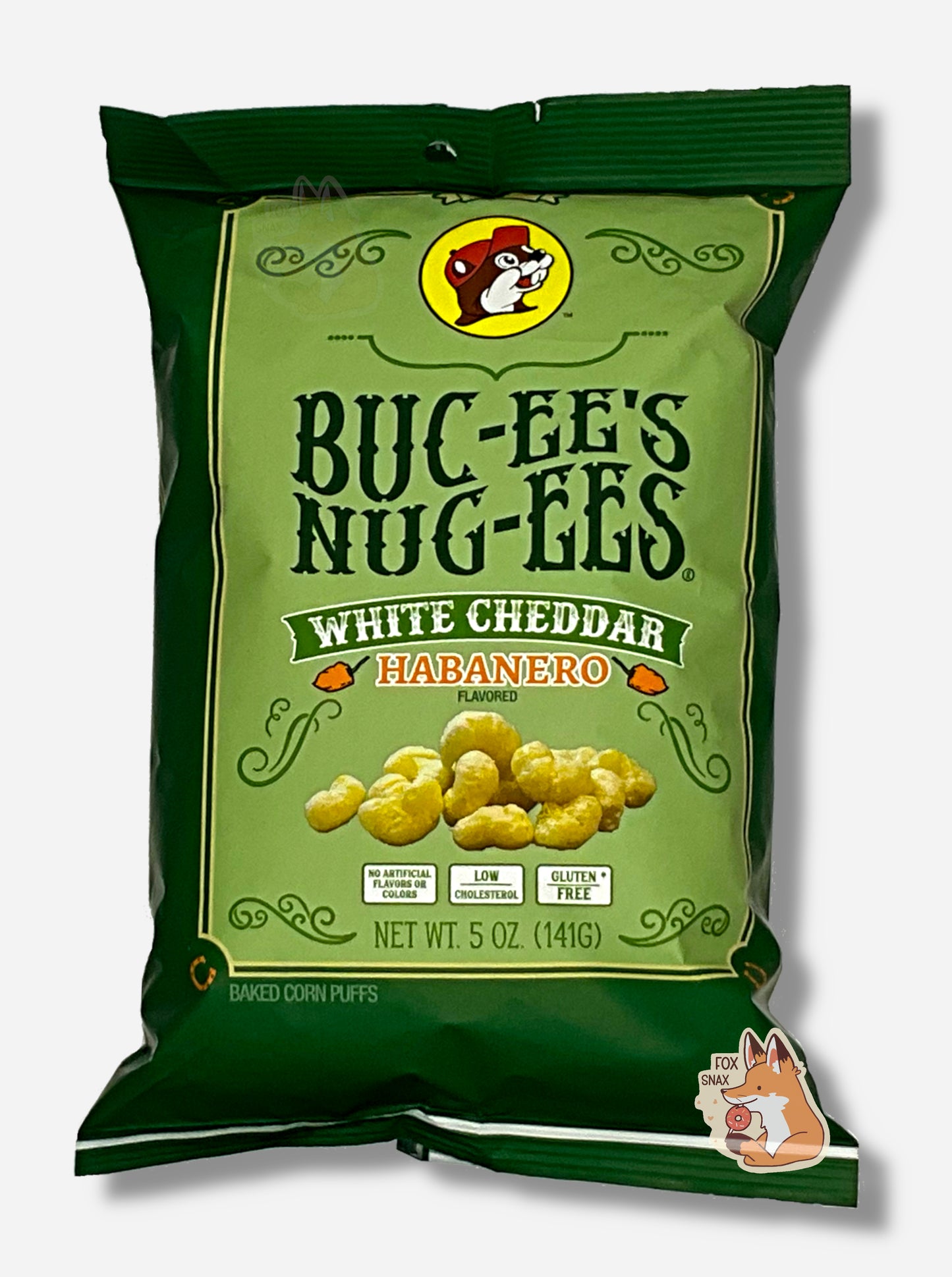 A picture of the front of a opaque, dark green and light green bag of Buc-ee's Nug-ees White Cheddar Habanero which are puffed corn snack with white cheddar and habanero pepper flavor, and has a picture of Buc-ee the Beaver on it. The bag reads White Cheddar Habanero Flavored, No Artificial Colors or Flavors, Low Cholesterol, Gluten Free, Baked Corn Puffs.