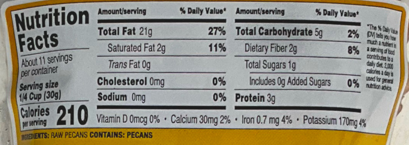 A closeup of the back of a bag of Buc-ee's Mammoth Pecans. Nutrition facts are listed below, then ingredients.