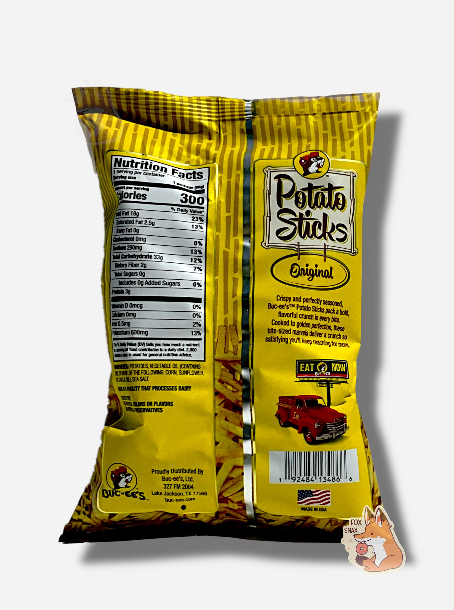 The back of a bag of Buc-ee's Original Potato Sticks. The bag is in dark and light yellow. Ingredients are listed, next to text that reads CRISPY AND PERFECTLY SEASONED, BUC-EE'S POTATO STICKS PACK A BOLD, FLAVORFUL CRUNCH IN EVERY BITE. COOKED TO GOLDEN PERFECTION, THESE BITE-SIZED MARVELS DELIVER A CRUNCH SO SATISFYING YOU'LL KEEP REACHING FOR MORE.
