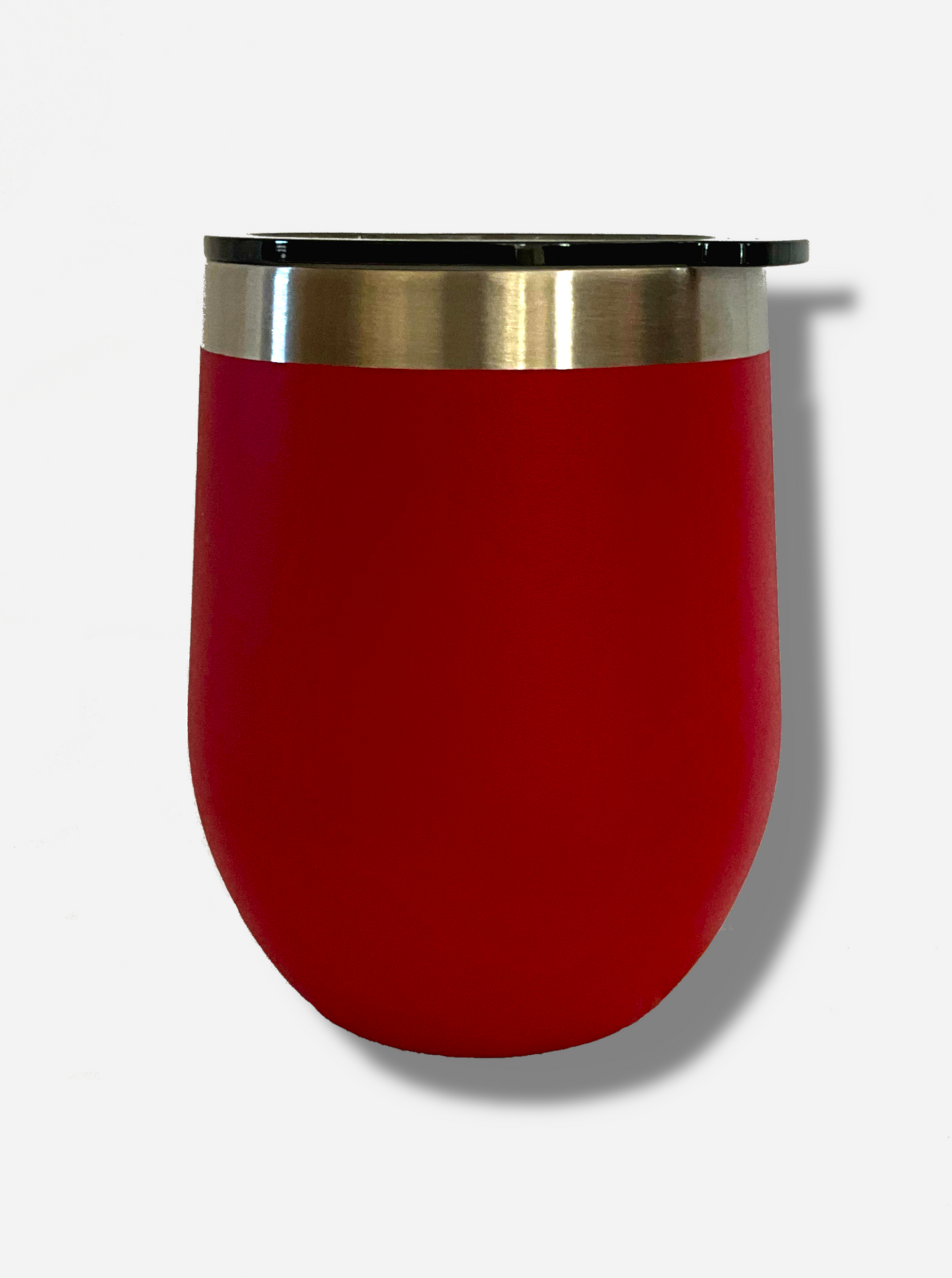 A picture of the back of a short red, sorta squatty, rounded tumber. Its surface is smooth and red, as it is red paint covering stainless steel. The top is plastic, and has a slider that fits three positions - fully open, partially closed, and closed. The top of the tumbler is lined with a stainless steel band.