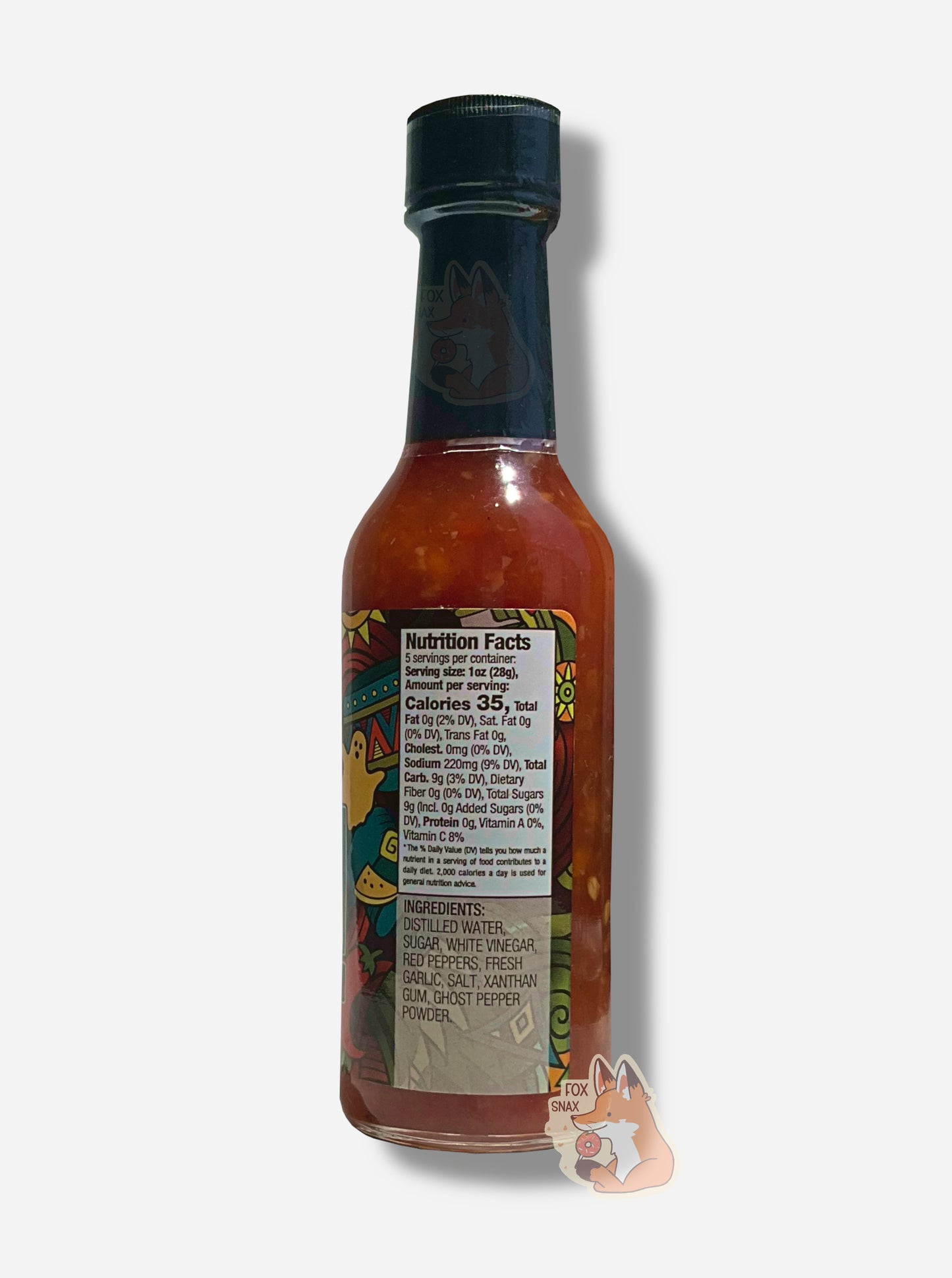 A picture of a small, tall glass bottle of hot sauce. The top of the bottle is sealed with a plastic top. The sauce inside is a red color, with pepper seeds visible.
