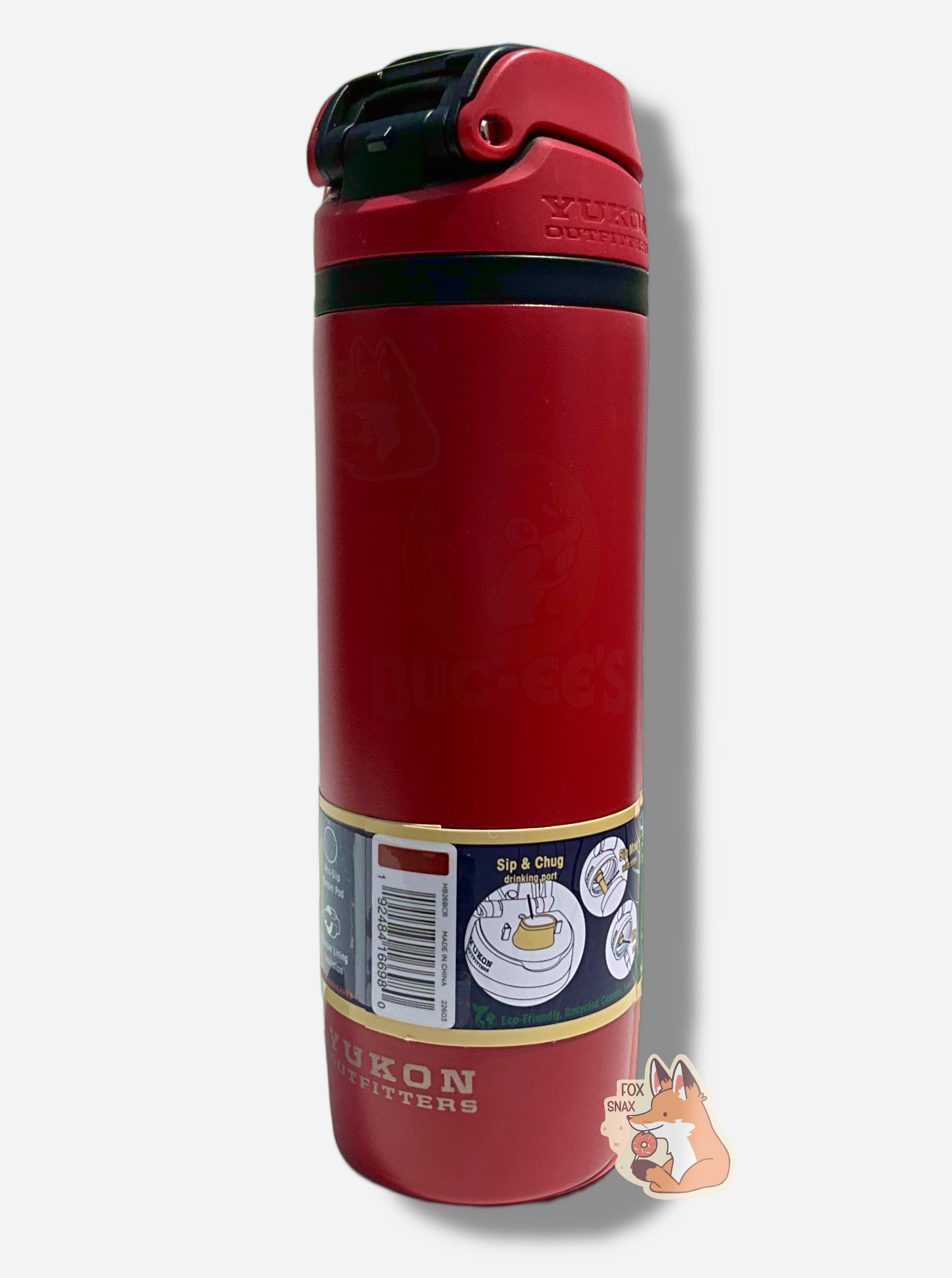 A picture of the back and side of a tall red cylindrical water bottle.  The surface is smooth and red, as it is red paint covering stainless steel.  The small plastic handle is closed.  The top is black and red plastic, and is closed.  A paper wrapper around the bottom reads: Sip & Chug drinking port, then Sip Mode With Straw, then Cug Mode Remove Straw.