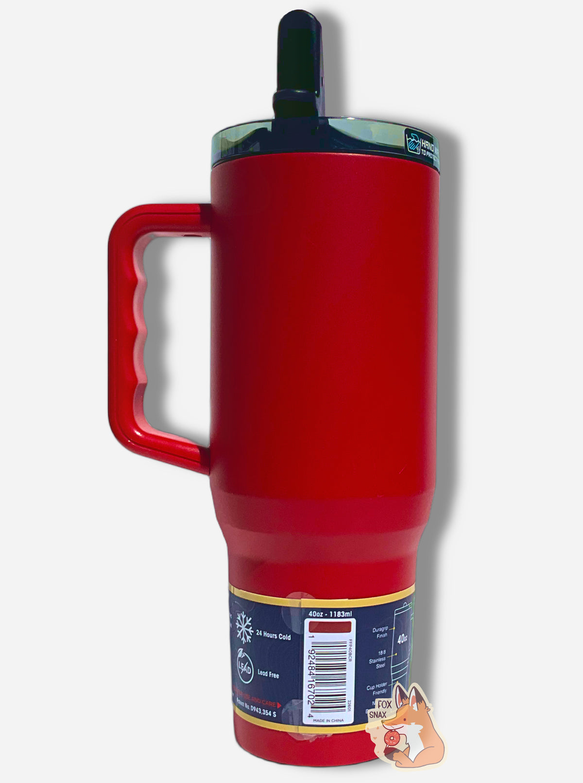 A picture of the back of a tall, red, sorta skinny tumbler.  The surface is smooth and red, as it is red paint covering stainless steel.  The handle and top are plastic.  A paper wrapper around the bottom has a diagram that reads Leakproof Straw Lid, Duragrip Finish, 18/8 Stainless Steel, Triple Wall Insulated, Cup Holder Friendly, Non Slip Bottom Pad.  Another section reads Triple Insulated Stainless Steel, Leakproof Straw Lid, 24 Hours Cold, Lead Free, then not for Hot Beverages / Content.