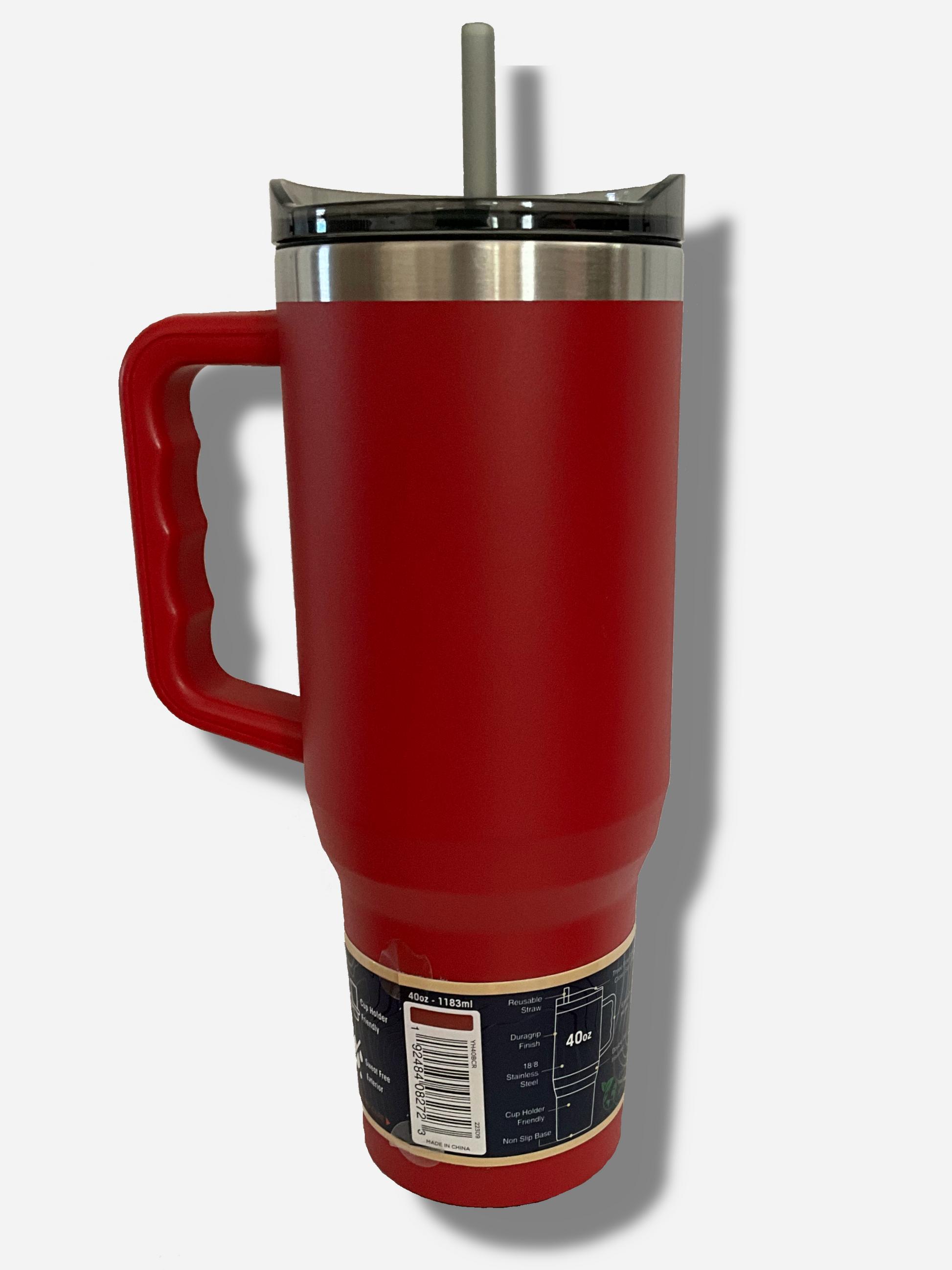 A picture of the back of a tall, red, sorta skinny tumbler.  The surface is smooth and red, as it is red paint covering stainless steel.  The handle, top, and straw are plastic.  The top of the mug is lined with a stainless steel band.  A paper wrapper around the bottom has a diagram that reads 40 oz, next to the barcode.