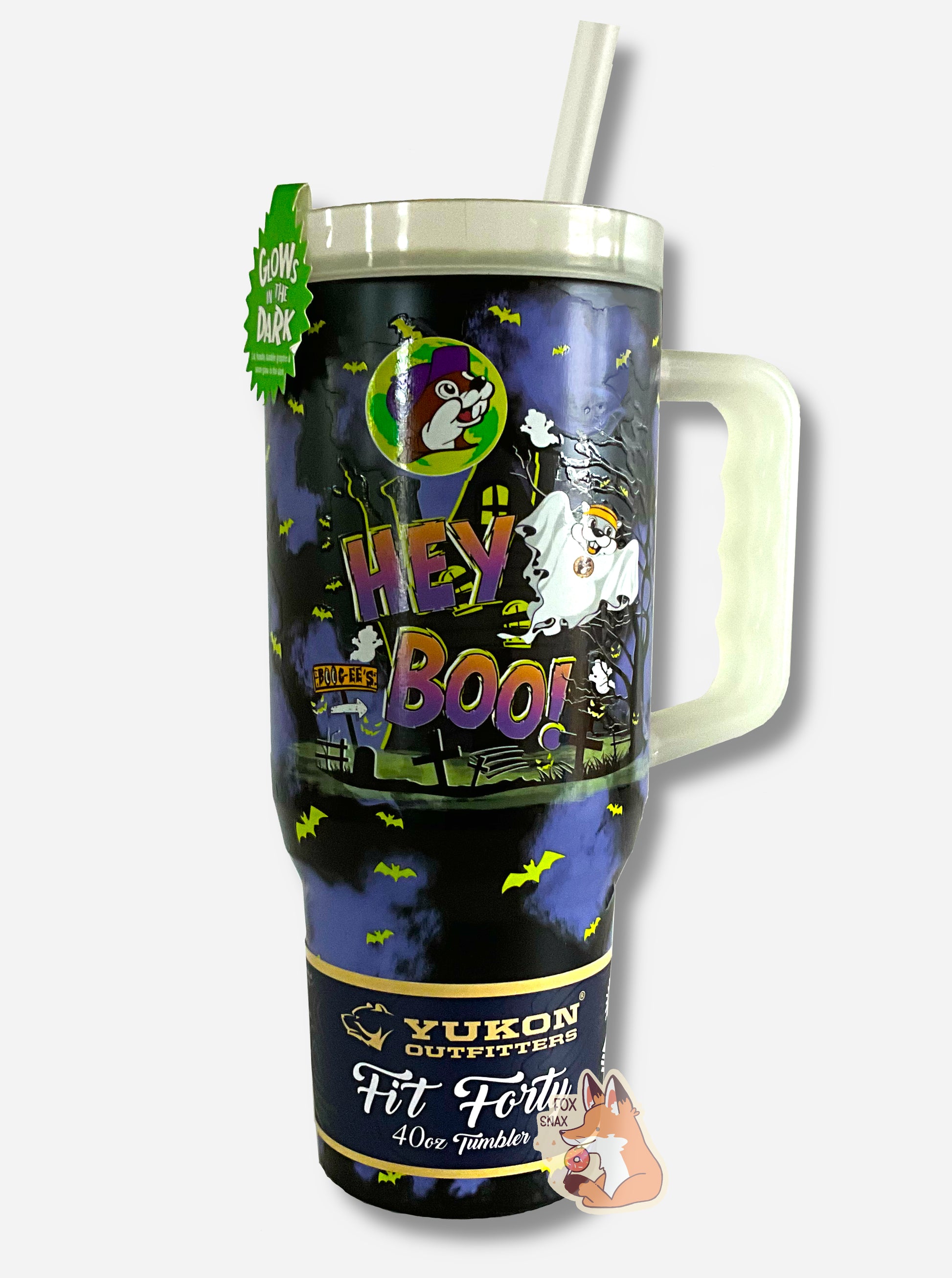 A picture of a tall, dark blue and black, sorta skinny tumbler, with HEY BOO! in a gradient text.  There's a lot going on in this tumbler: the background has a haunted house, there's a ghost of Buc-ee floating away, smiling, and the full moon is covered in a Buc-ee's logo.  Glow in the dark bats dot the sky.  The tumbler is paint covering stainless steel.  The handle, top, and straw are plastic. A paper wrapper around the bottom reads: Yukon Outfitters.  Fit Forty 40 oz Tumbler.  