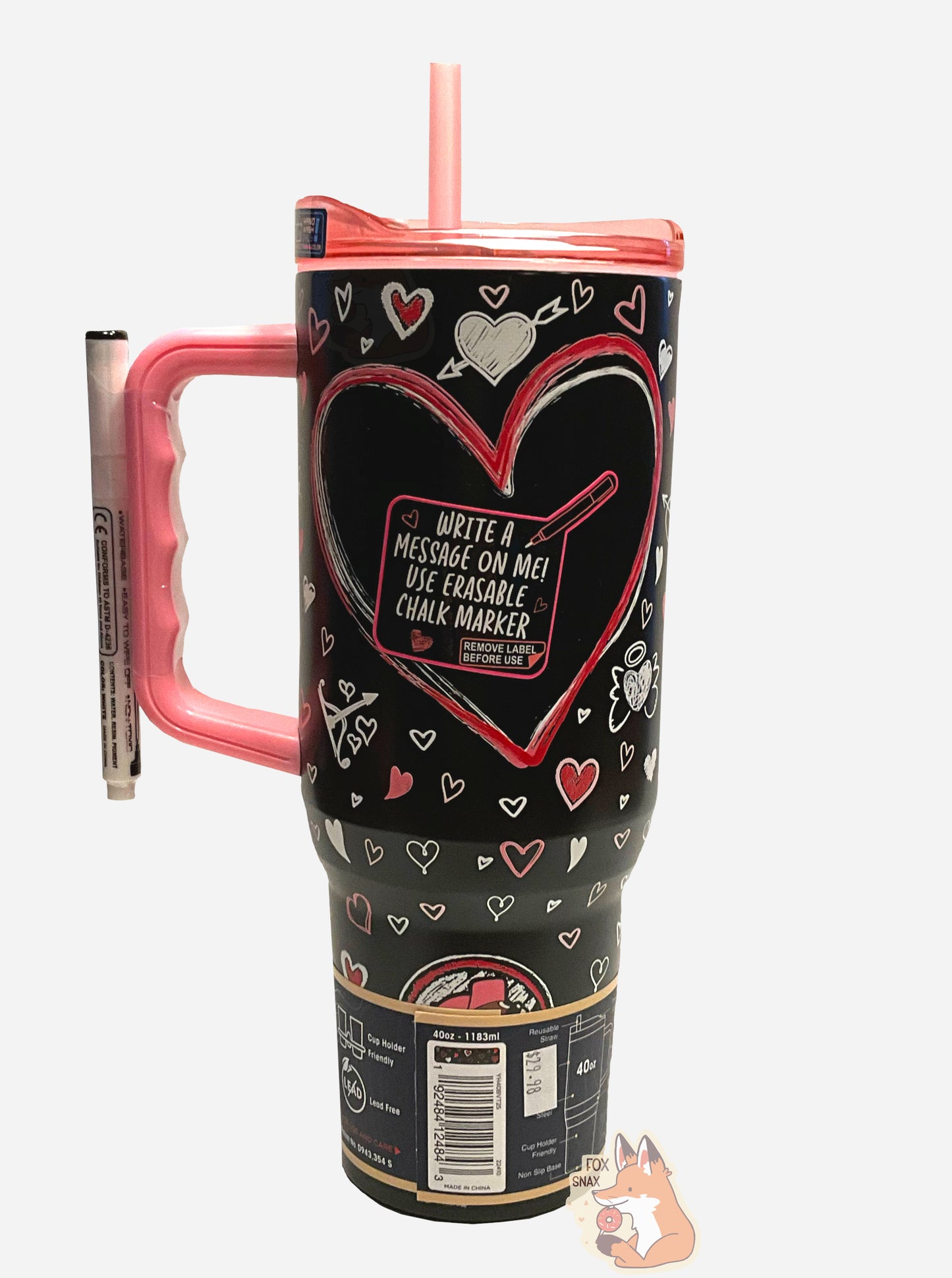 A picture of a tall, skinny, black, 40 oz tumbler.  The lid, handle, and straw are pink (the top is transparent pink).  The body of the tumbler is black, and in the middle has a large black heart with a sticker on it.  The sticker reads WRITE A MESSAGE ON ME! USE ERASABLE CHALK MARKER.  The rest of the tumbler is decorated with white and pink hearts, and on the bottom, a Buc-ee's logo can be seen.  A white chalk marker is taped to the handle.