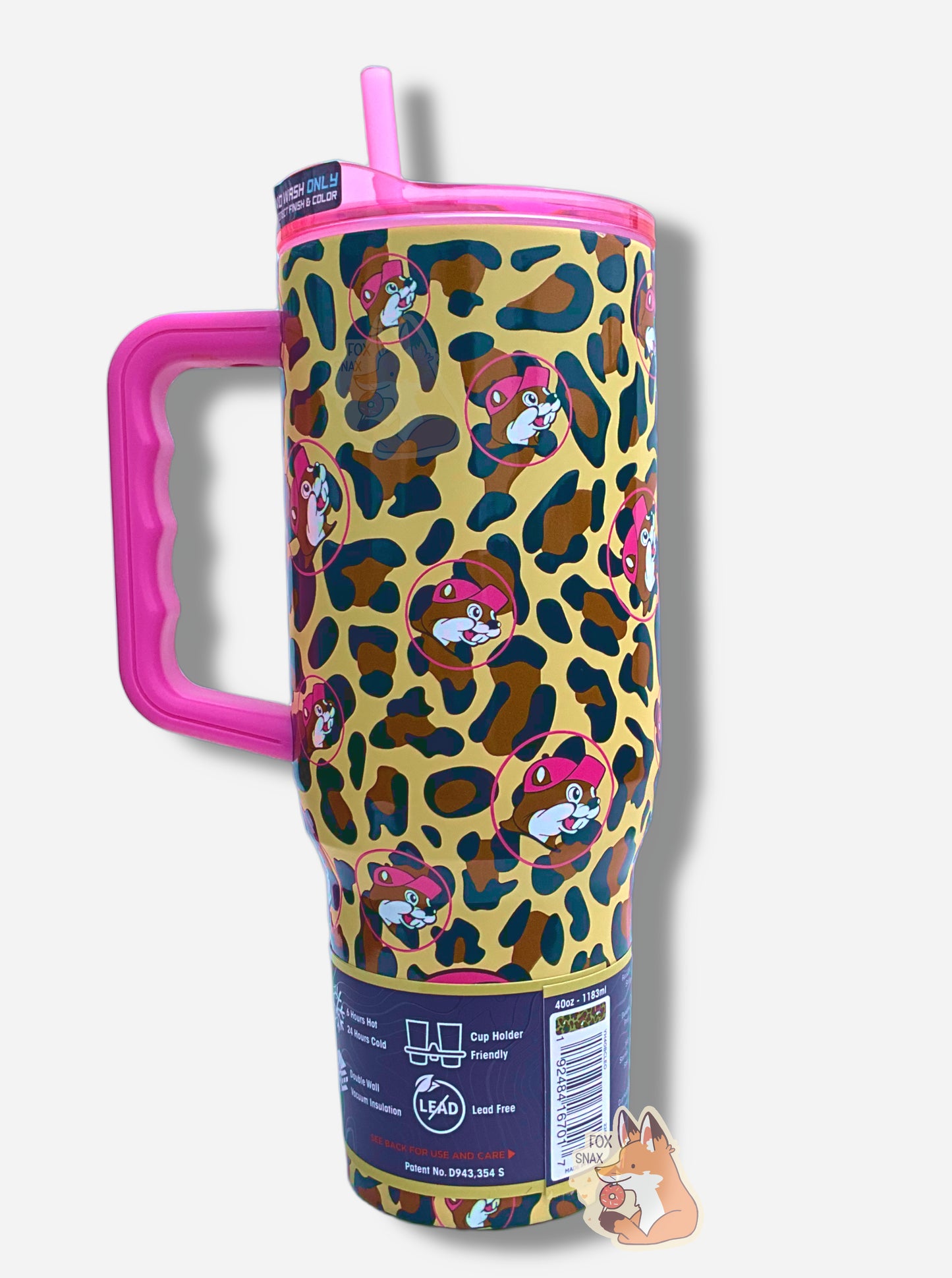 A picture of the back of a tall, gold, sorta skinny tumbler.  The surface is a leopard print, as it is matte leopard-colored paint covering stainless steel.  The handle, top, and straw are hot pink plastic.  The top of the mug is lined with a stainless steel band.  A paper wrapper around the bottom has a diagram that reads 40 oz, next to the barcode.