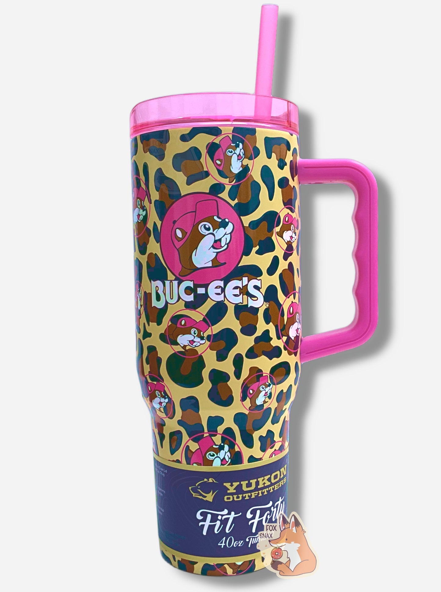 A picture of a tall, pink and leopard print, sorta skinny tumbler, with a big picture of Buc-ee The Beaver on it.  Buc-ee's hat, and the circle behind him, is in hot pink.  The surface is a leopard print, as it is matte paint in leopard colors covering stainless steel.  The handle, top, and straw are hot pink and plastic.  A paper wrapper around the bottom reads: Yukon Outfitters.  Fit Forty 40 oz Tumbler.