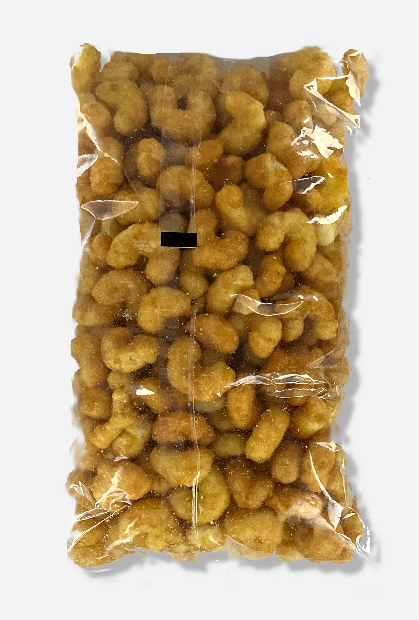 A picture of the back of a clear plastic bag of Buc-ee's Beaver Nuggets, which are puffed corn snack with caramel flavors.