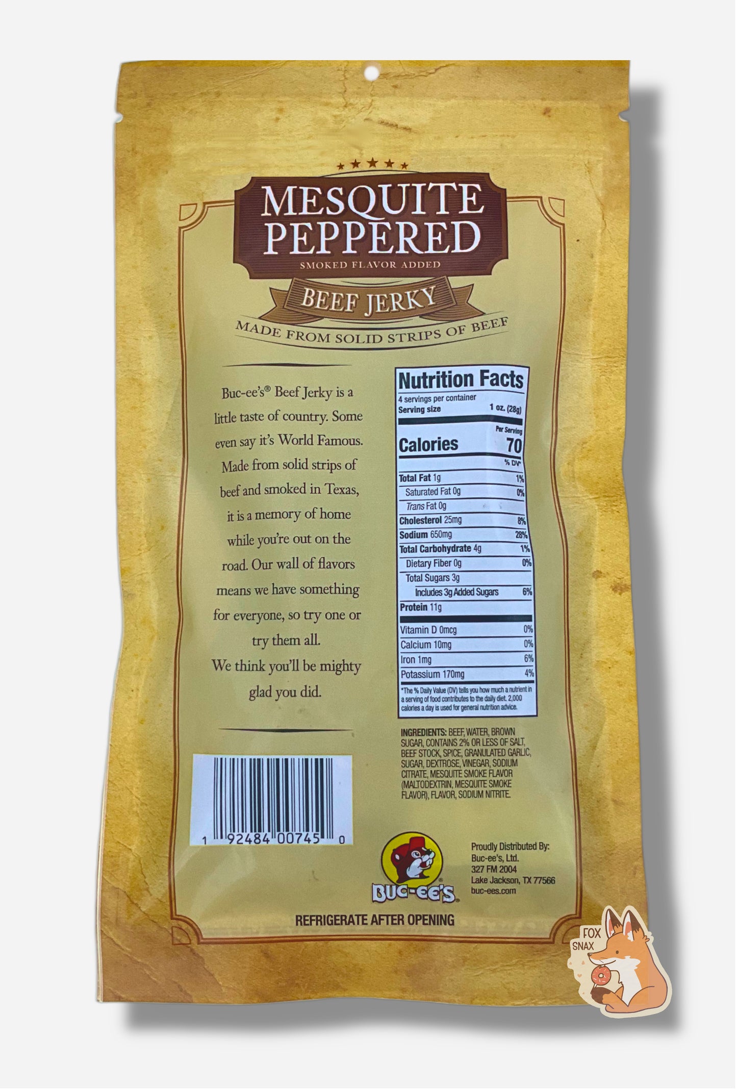 A picture of the front of a tan plastic bag of Buc-ee's Mesquite Peppered Jerky.  The logo is in brown with white text.The label underneath reads 'Smoked Flavor Added', then 'Beef Jerky', then 'Made From Solid Strips Of Beef'. Nutrition facts and ingredients are shown.