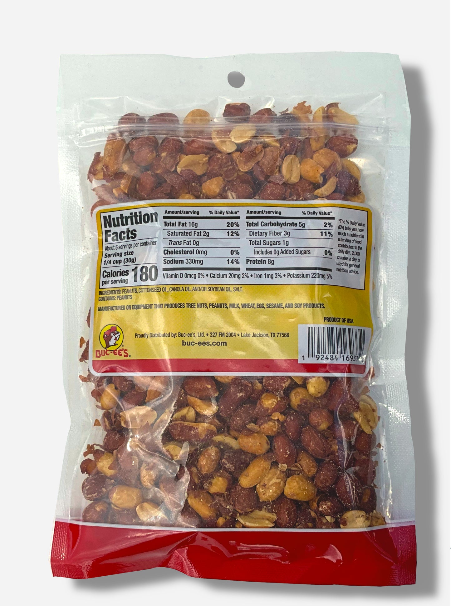 A picture of the back of a resealable bag of Buc-ee's Salted Southern Fried Peanuts, which are deep fried, shelled peanuts.  The peanuts inside are differing shades of brown and tan, and show a few grains of salt on them or in the bag.  Nutrition facts, then ingredients are displayed.