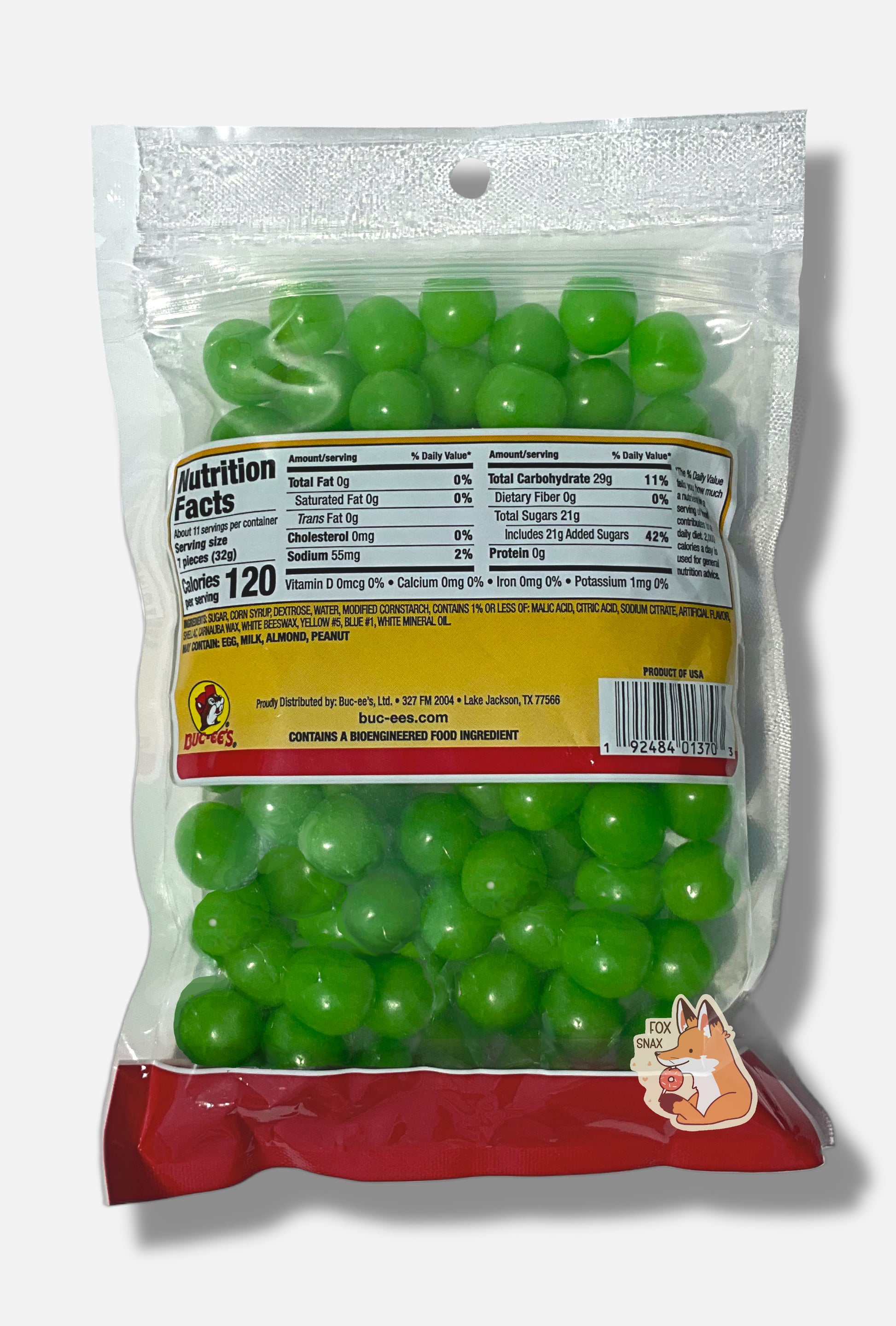 A picture of the back of a clear resealable bag of Buc-ee's Watermelon Sours, which are  bright green, sour and sweet spherical candies.  