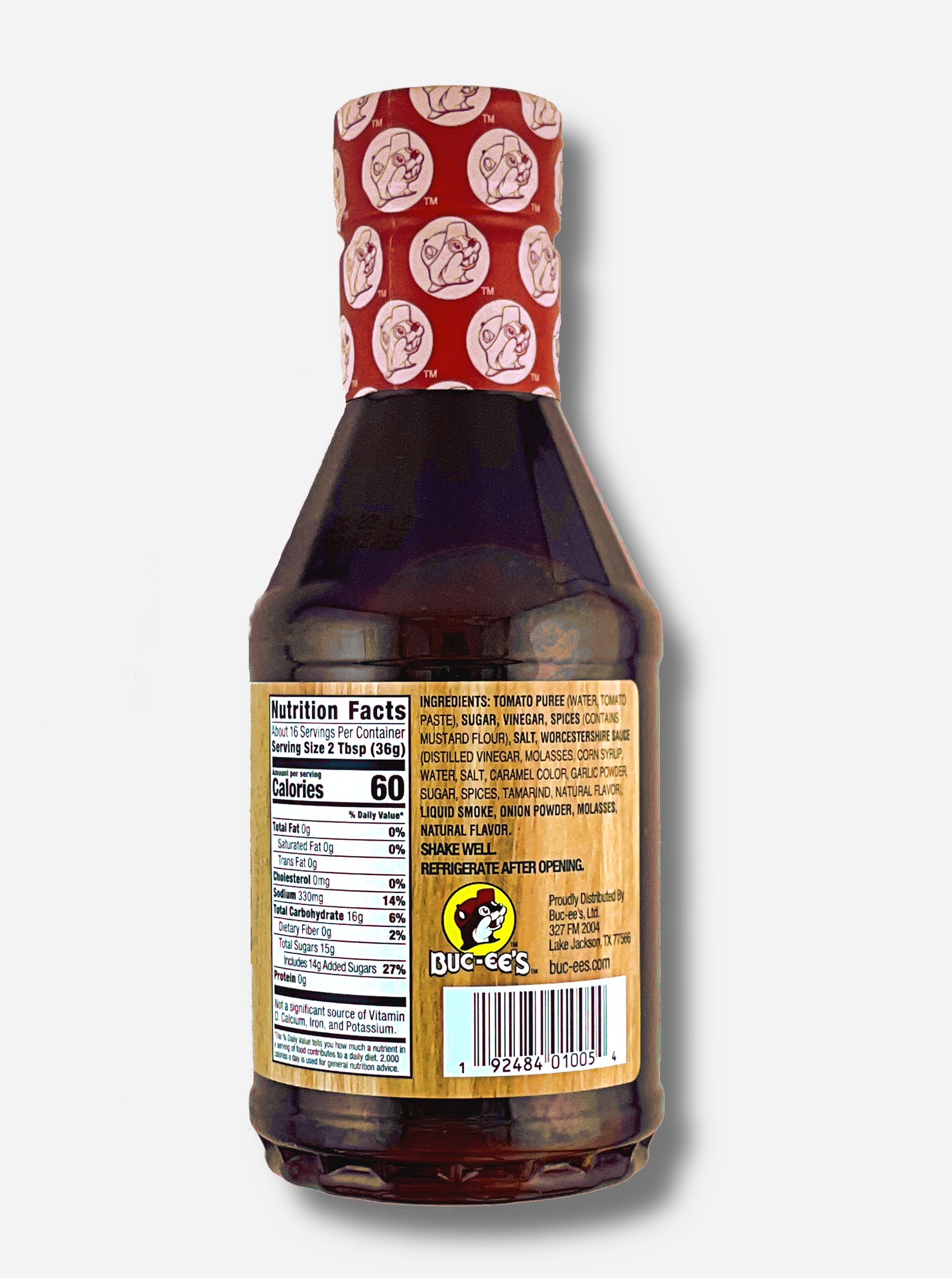 The back of a plastic bottle of Buc-ee's Premium Recipe BBQ Sauce, Original.  The top of the bottle is sealed with a plastic wrap in red and white, dotted with Buc-ee's logos.  The BBQ label is a woodgrain, with a small Buc-ee logo on the bottom.  The label reads: SHAKE WELL.  REFRIGERATE AFTER OPENING.  