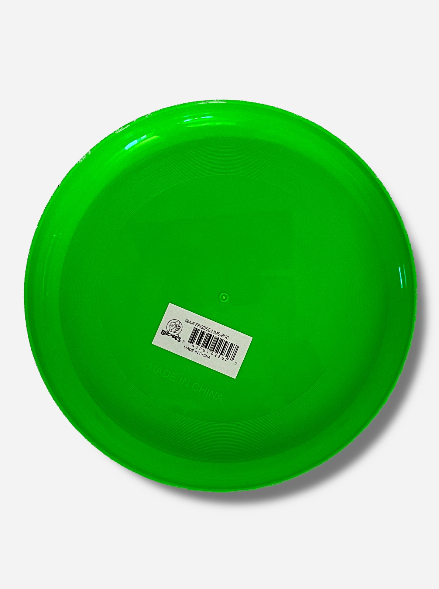 A picture of the back of a large, lime green flying disc toy.  