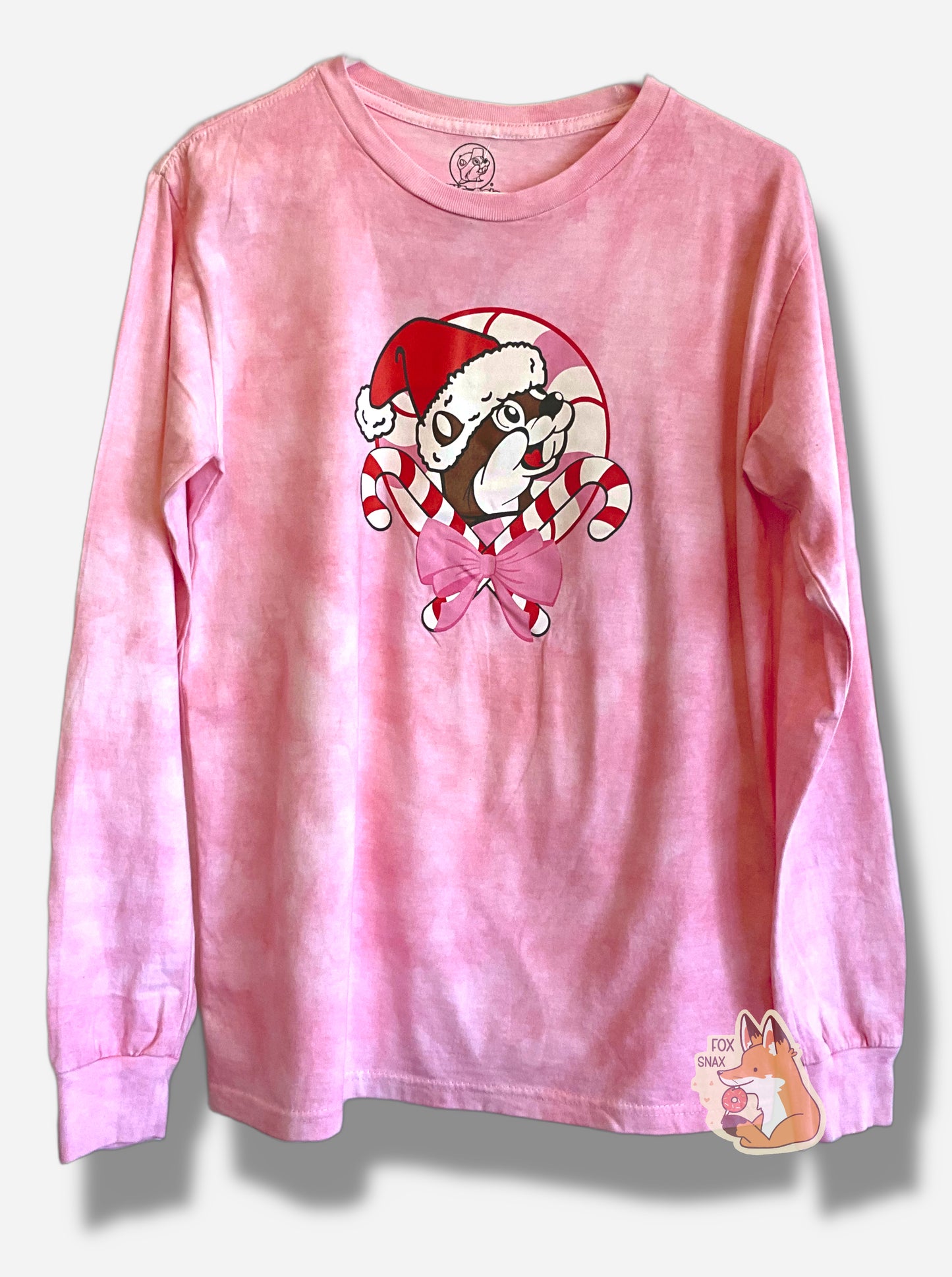 A picture of a pink sorta-tie dyed long sleeve shirt.  The shirt has the Buc-ee's logo on it - a cheerful, brown furred beaver with a significant overbite - but Buc-ee's wearing a red Santa cap, and is framed by two candy canes on the bottom of the image.  A pink bow ties the candy canes together.