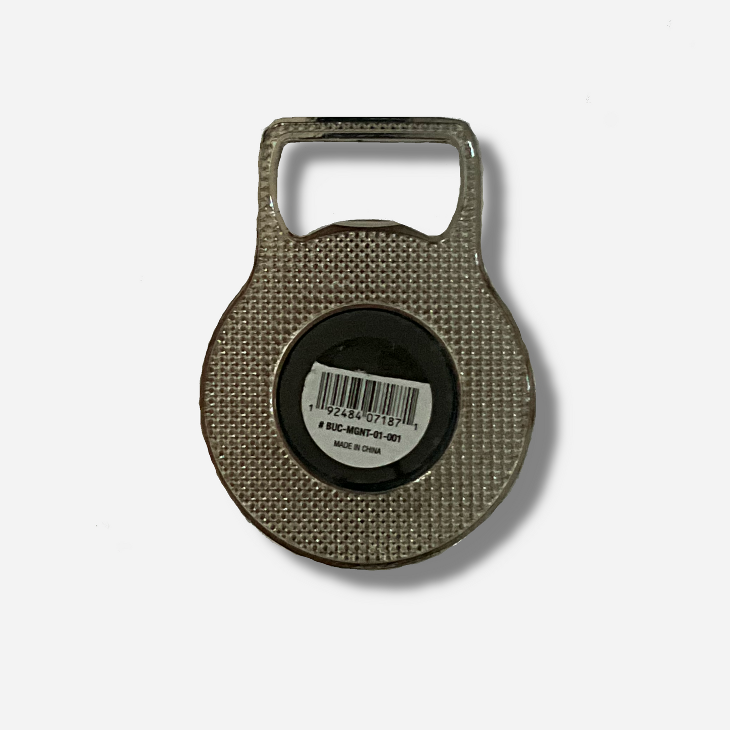 A picture of the back of a metallic bottle opener.  The top of the opener is a grey metal and shaped to open bottles.  The bottom of the opener has a large circle magnet on it.