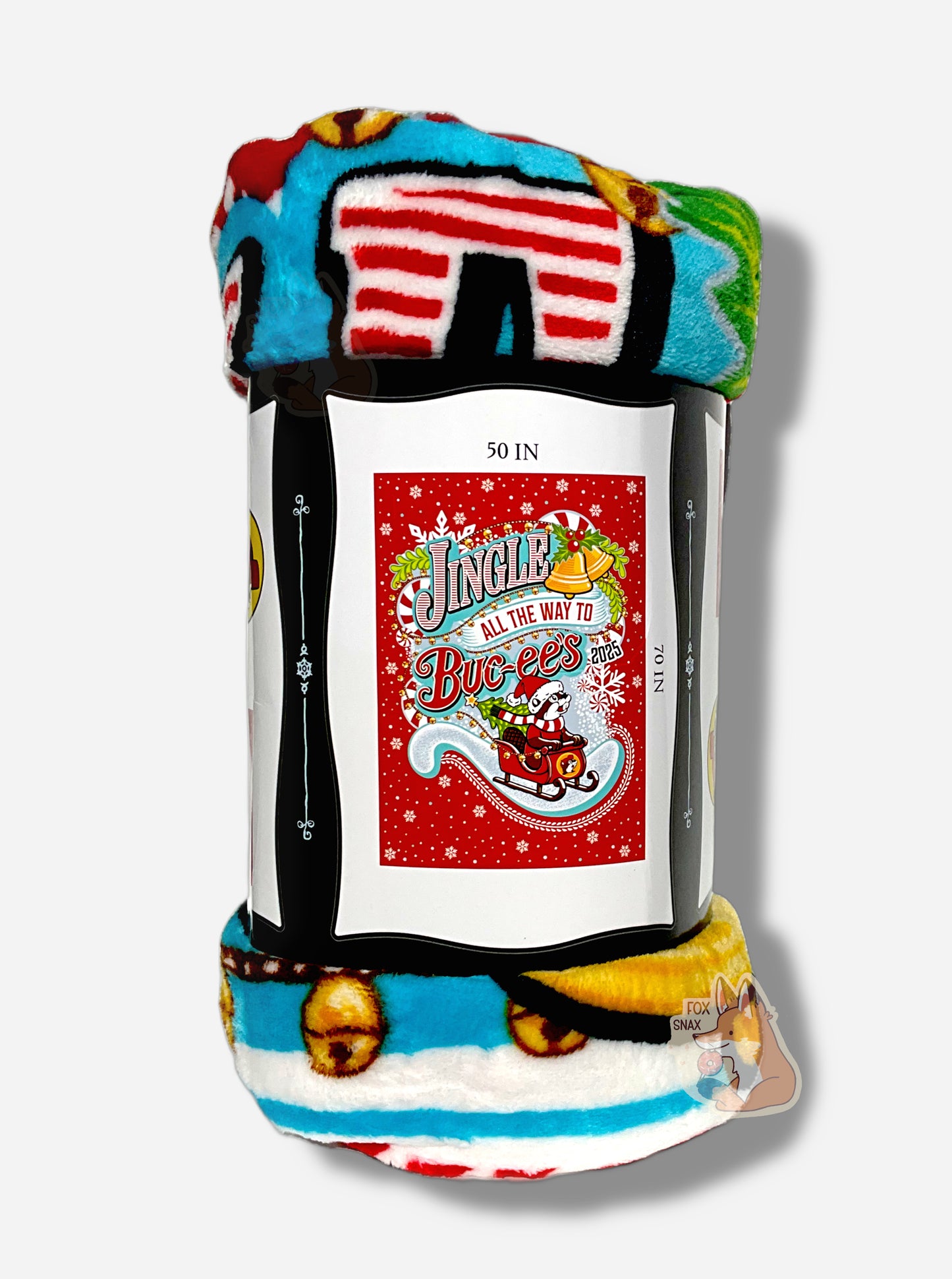 A picture of the side of a soft white, blue, blank, yellow, green, and red (!) blanket featuring Buc-ee the Beaver in a red Christmas sleigh, with a green Christmas tree in the back.  Buc-ee is holding the front of the sleigh, and is wearing a Christmas cap and red and white striped scarf.  The background is in red, framed by white snowflakes at the top, and reads JINGLE ALL THE WAY TO BUC-EE'S.  The short side of the blanket reads 50 IN, the long side 70 IN.