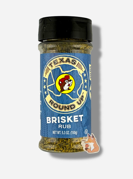 A picture of the front of a container of Texas Round Up Brisket Rub.  The container has a black plastic flip lid, and a clear plastic body.  The spices inside appear in shades of grey and black.  The label reads TEXAS ROUND UP, with an outline of the state of Texas, with a picture of Buc-ee The Beaver in the middle.  Beneath that, the blue label reads in white text, Brisket Rub.  Net Wt 5.3 Oz (150g).