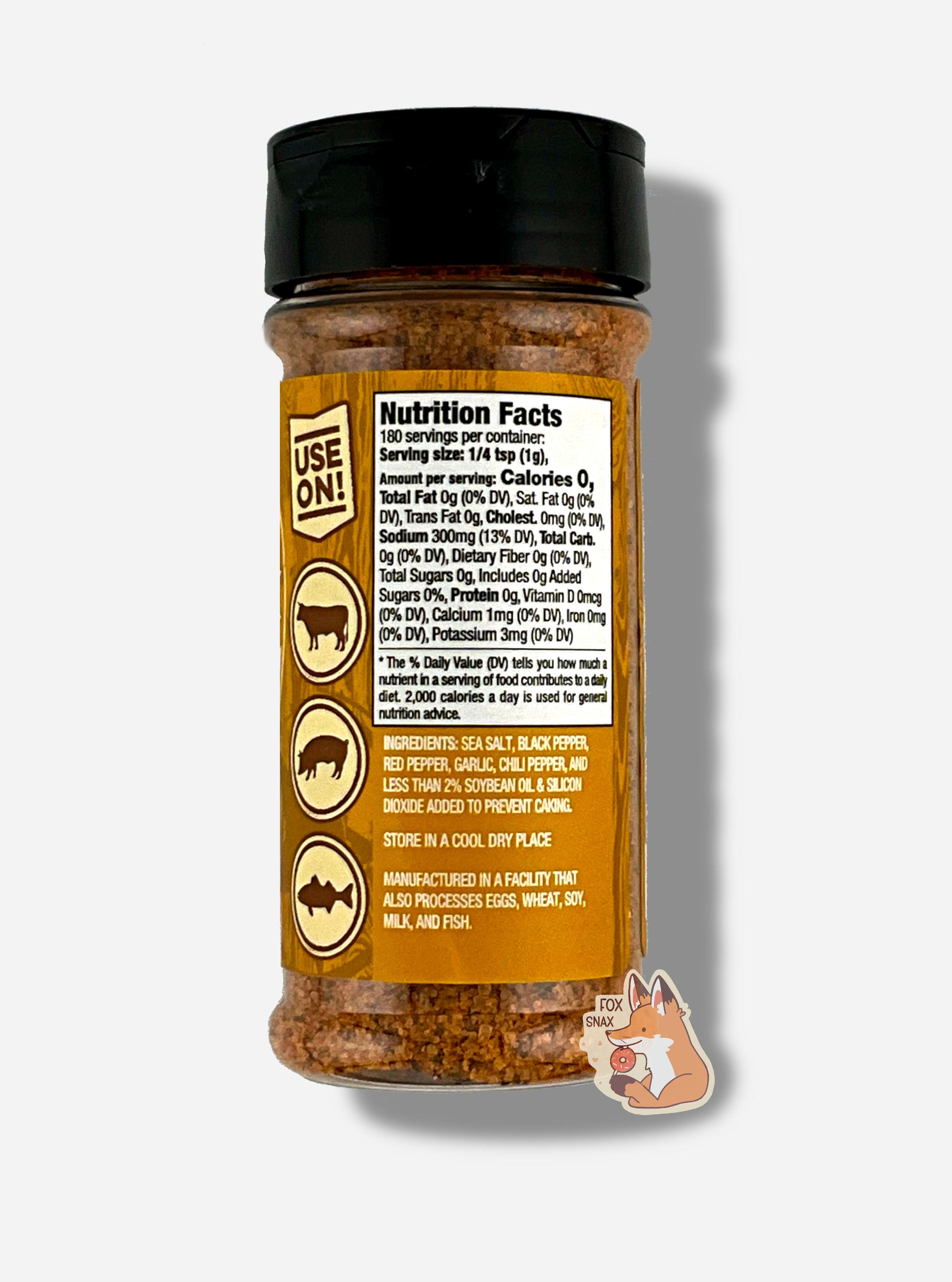 A picture of the back of a container of Texas Round Up Cajun Seasoning. The container has a black plastic flip lid, and a clear plastic body.  The spices inside appear orange and grey. The tan label reads USE ON!, and beneath that, there is an outline of a cow, a pig, and a chicken.