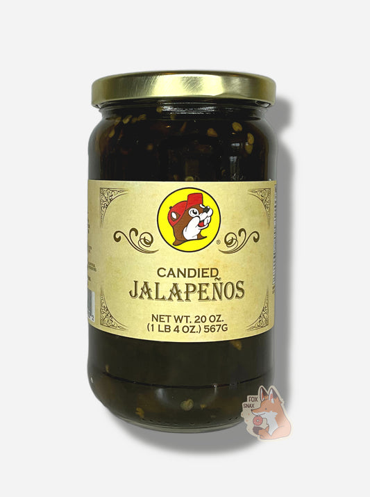 A picture of the front of a glass jar of Buc-ee's Candied Jalapeños - the label is a "old-timey" sort of white/yellow with flared edges.  The middle has a giant Buc-ee the Beaver logo on it.  In the jar, dark green jalapeños can be seen.