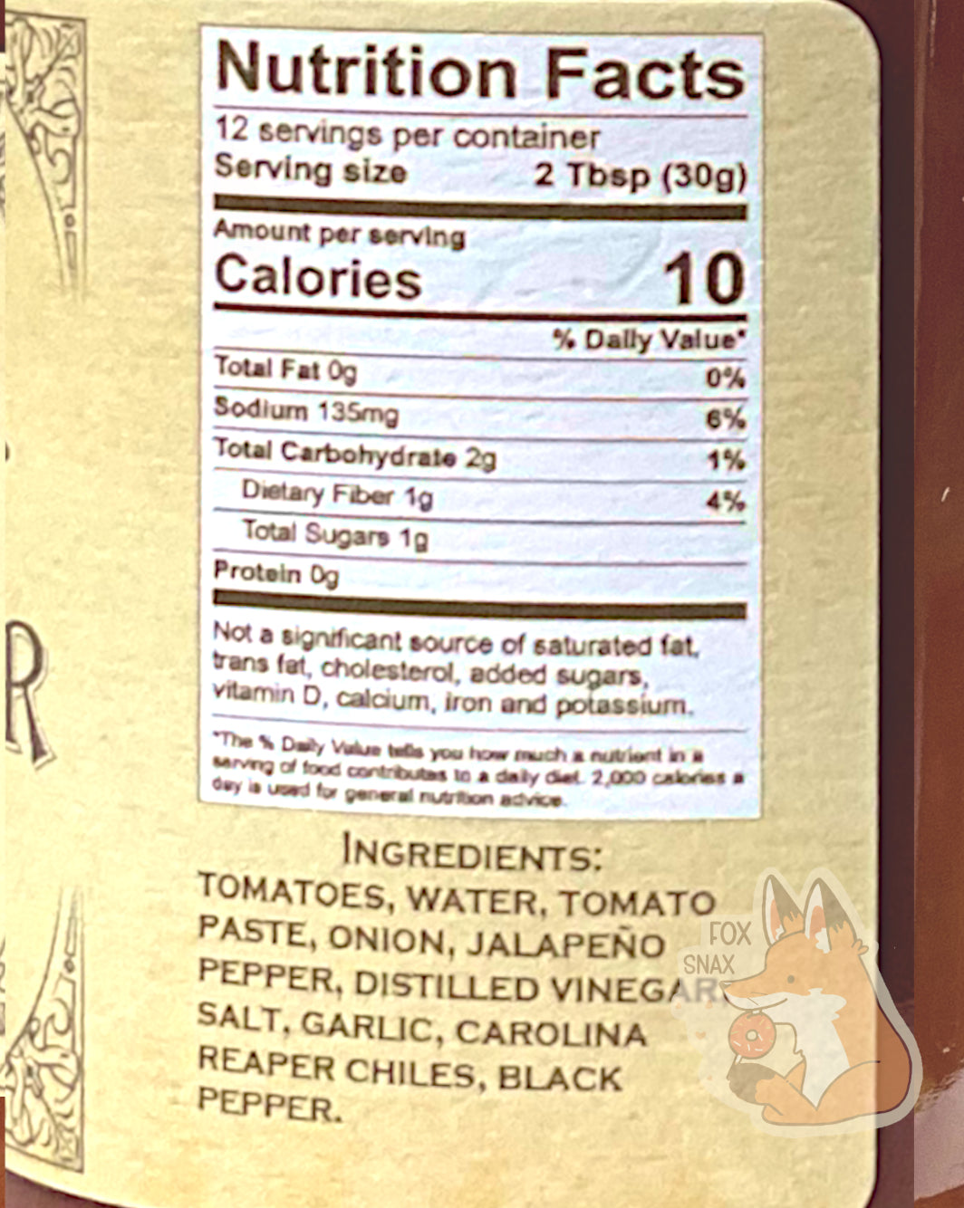 Nutrition facts label on the Picked Habanero Garlic.  It reads: NUTRITION FACTS.  12 SERVINGS PER CONTAINER.  SERVING SIZE 2 TBSP (30 g).  CALORIES 10.  TOTAL FAT 0%.  SODIUM 6%.  TOTAL CARBOHYDRATE 2g 1% DIETARY FIBER 1g TOTAL SUGARS 1g PROTEIN 0G.  NOT A SIGNIFICANT SOURCE OF SATURATED FAT, TRANS FAT,  CHOLESTEROL, DIETARY FIBER, VITAMIN D, CALCIUM, IRON, AND POTASSIUM.    An ingredient list is also displayed.