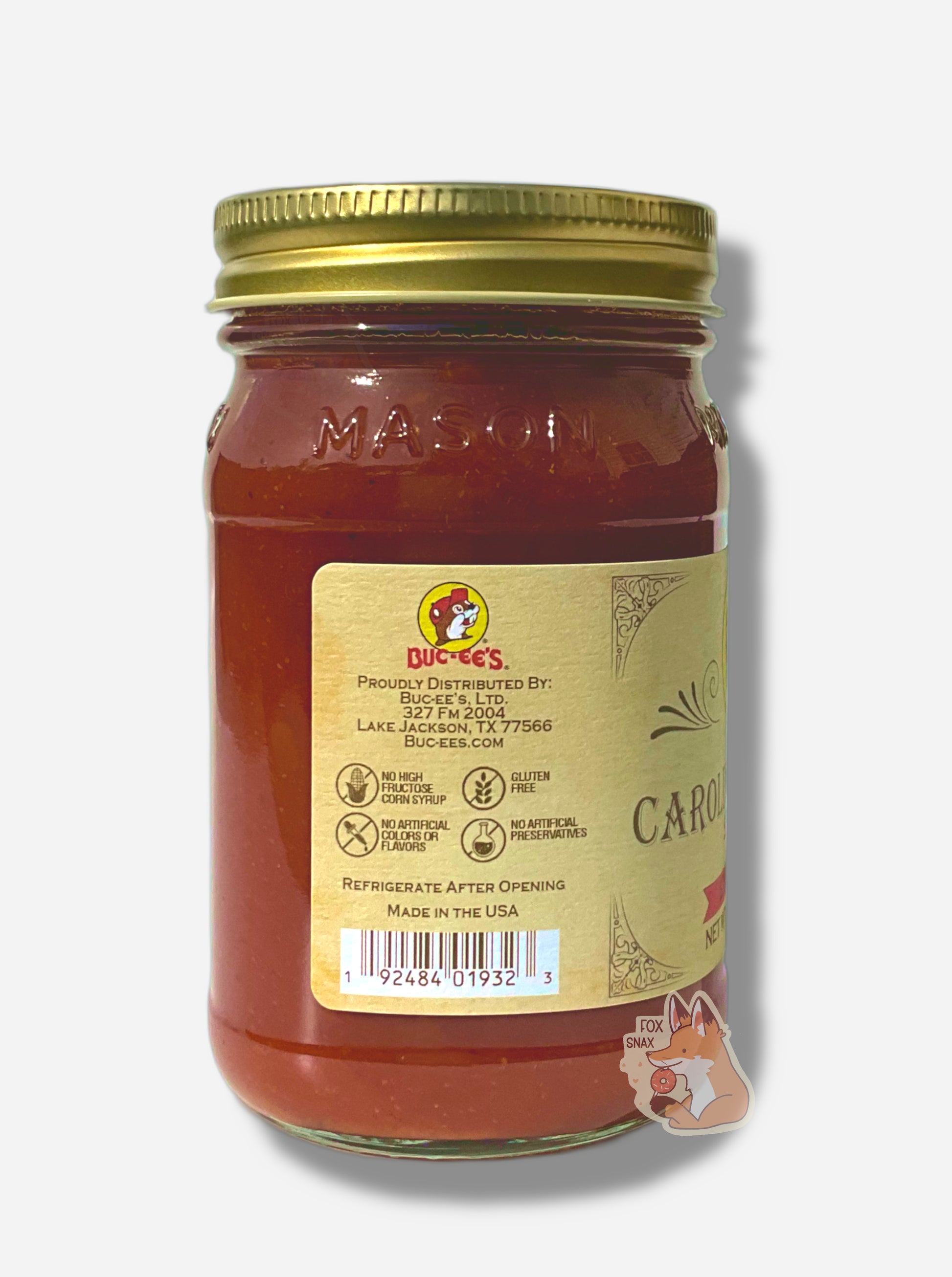 A picture of the left side of a glass jar of Buc-ee's Carolina Reaper Salsa - the label is a "old-timey" sort of white/yellow with flared edges.  The middle reads No High Fructose Corn Syrup, No Artificial Colors Or Flavors, Gluten Free, No Artificial Preservatives. In the jar, reddish salsa can be seen.