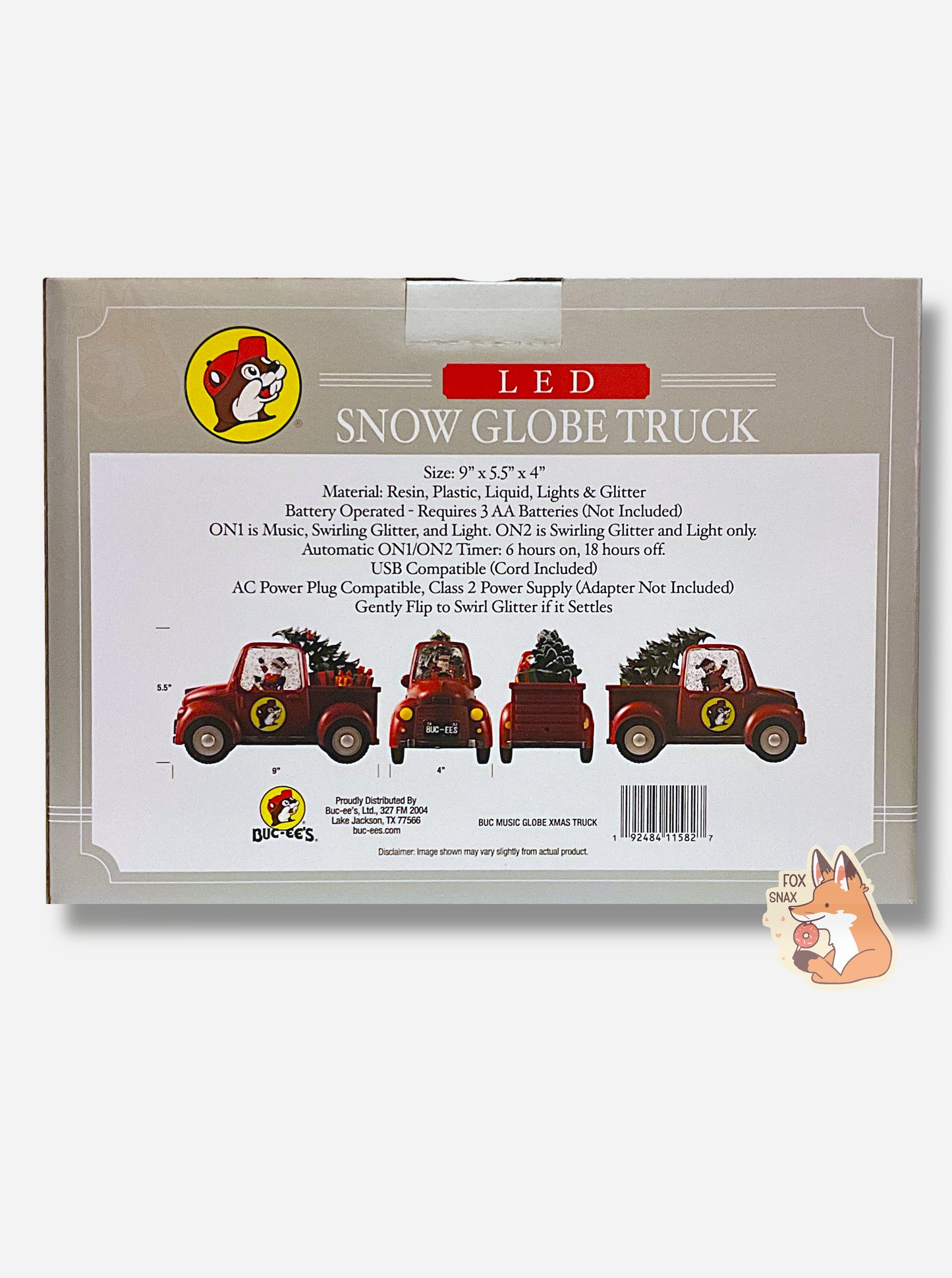 A picture of the back of a grey rectangular box for Buc-ee's LED SNOW GLOBE TRUCK.  The back reads: SIZE: 9"x5.5"x4". MATERIAL: Resin, Plastic, Liquid, Lights & Glitter.  Battery Operated - Requires AAA Batteries (Not Included).  ON1 is Music, Swirling Glitter, and Light. ON2 is Swirling Glitter and Light only.  There are four pictures of the red truck shown on the front of the box.