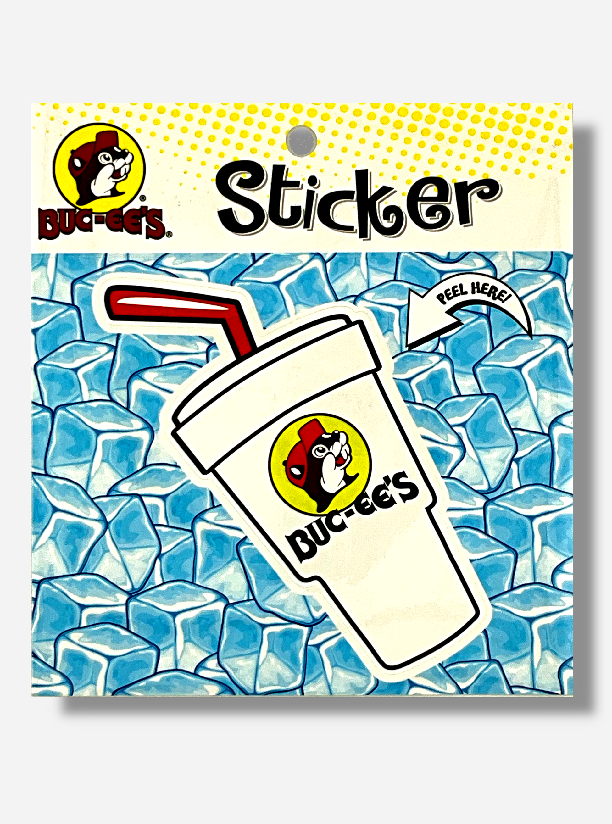 A picture of a Buc-ee's vinyl sticker.  The sticker is of a large white Styrofoam drink cup.  A red straw pokes out of the top of it, in a cartoonish fashion.  The cup has a large Buc-ee's logo on it, which is a cheerful beaver with a red ball cap, and underneath the logo, text in black reading BUC-EE'S.  On the sticker's packaging are the words PEEL HERE!, which point to the styrofoam cup sticker.  The background of the sticker reads STICKER, and shows blue ice cubes.