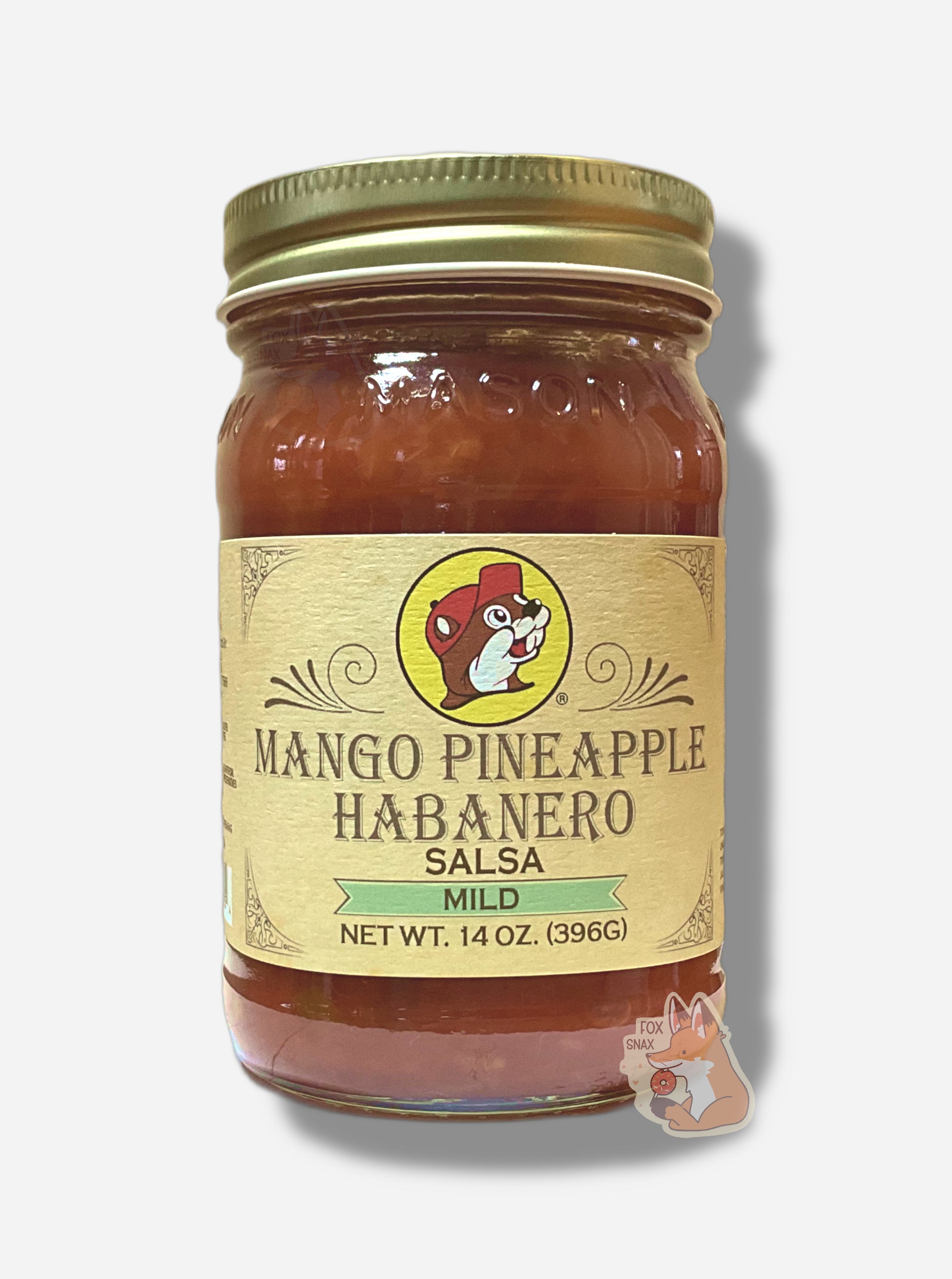 A picture of the front of a glass jar of Buc-ee's Mango Pineapple Habanero Salsa (Mild)  - the label is a "old-timey" sort of white/yellow with flared edges.  The middle has a giant Buc-ee the Beaver logo on it.  In the jar, reddish salsa can be seen.